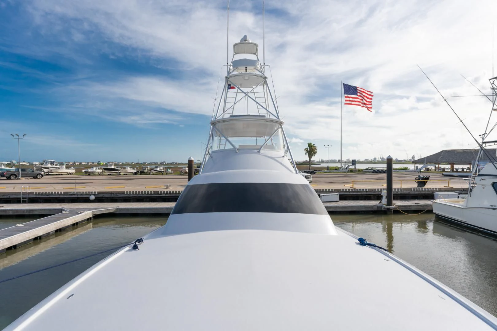 a large ship in a harbor aboard LET  RIDE Yacht for Sale