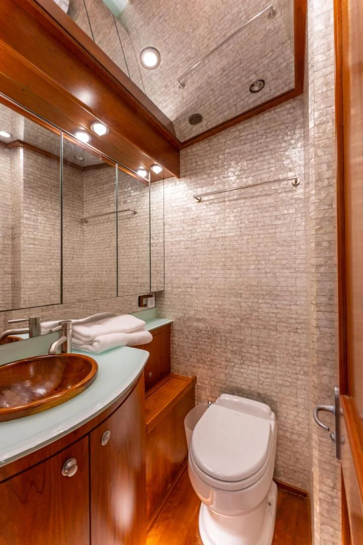 a bathroom with a sink and a toilet aboard LET  RIDE Yacht for Sale