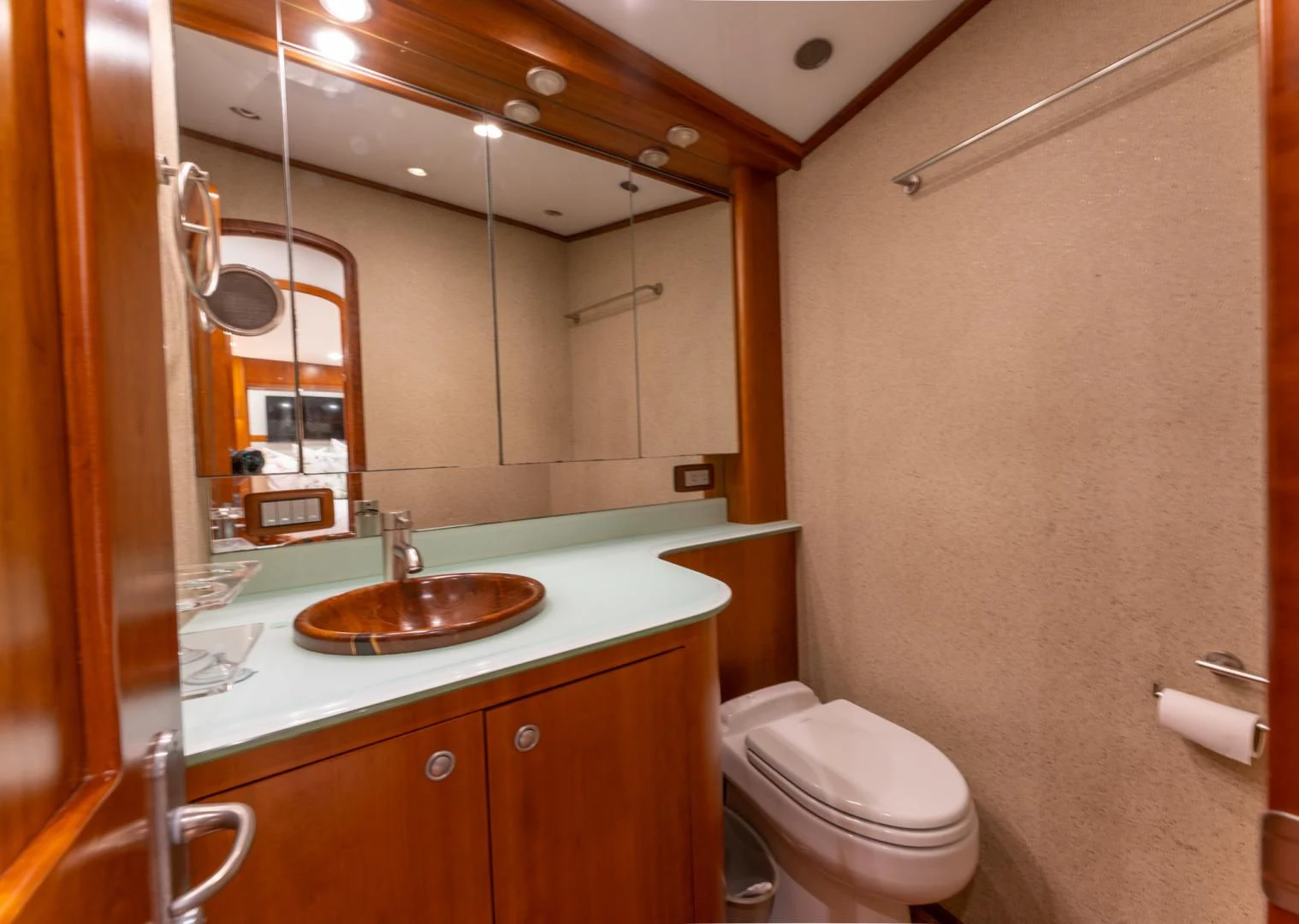 a bathroom with a sink toilet and a mirror aboard LET  RIDE Yacht for Sale