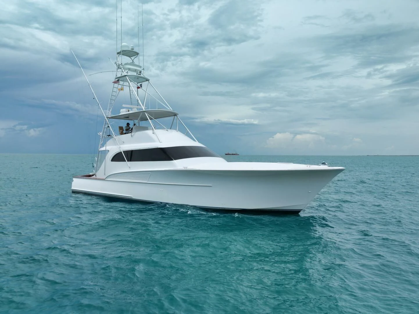 a white boat in the water aboard LET  RIDE Yacht for Sale