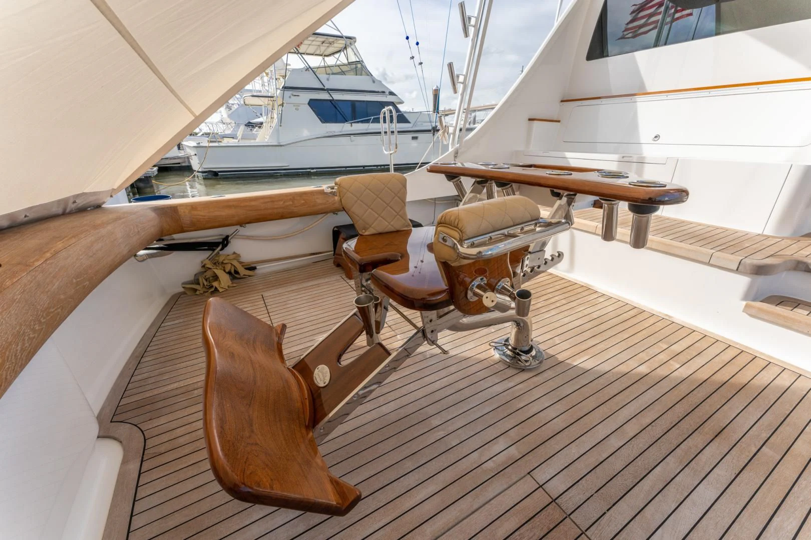 a wooden boat on a deck aboard LET  RIDE Yacht for Sale