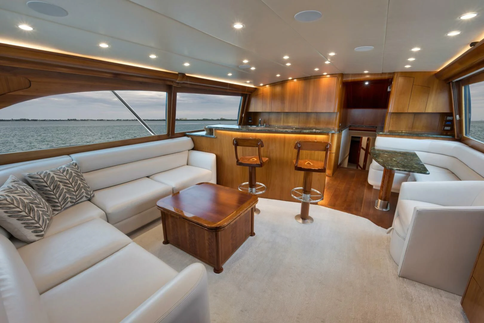 a large living room with a large window aboard LET  RIDE Yacht for Sale