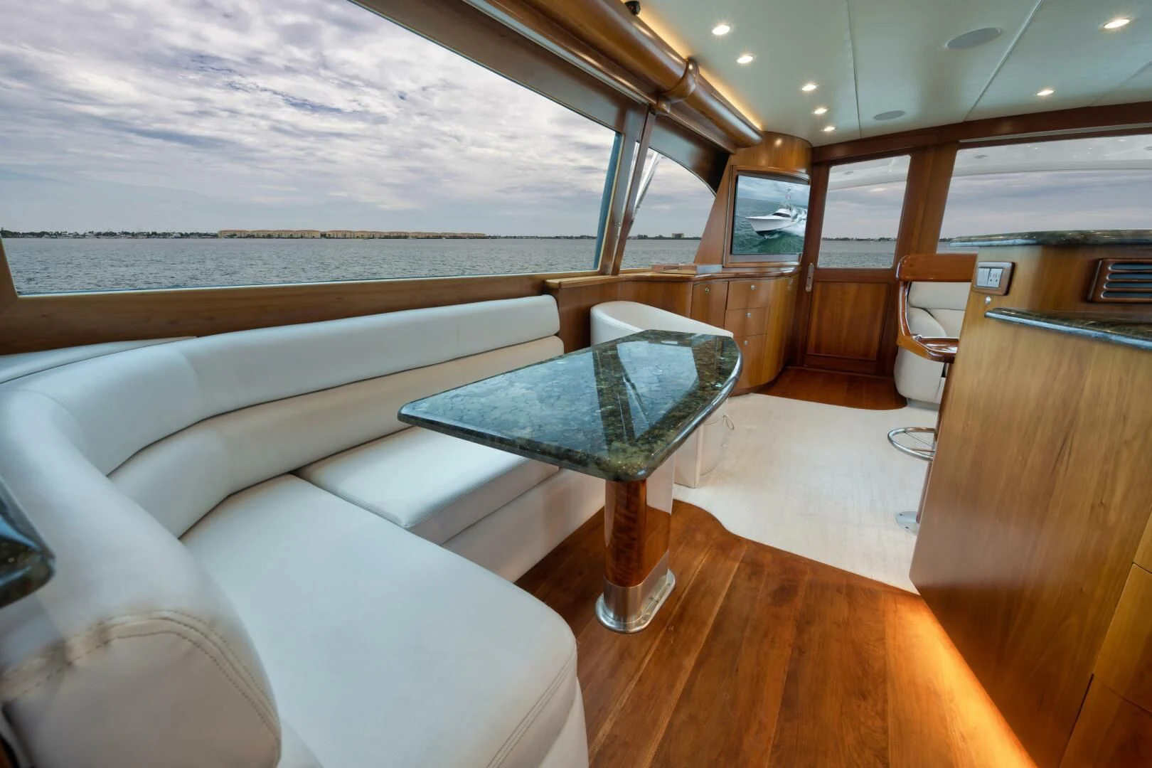 a room with a couch and a table aboard LET  RIDE Yacht for Sale