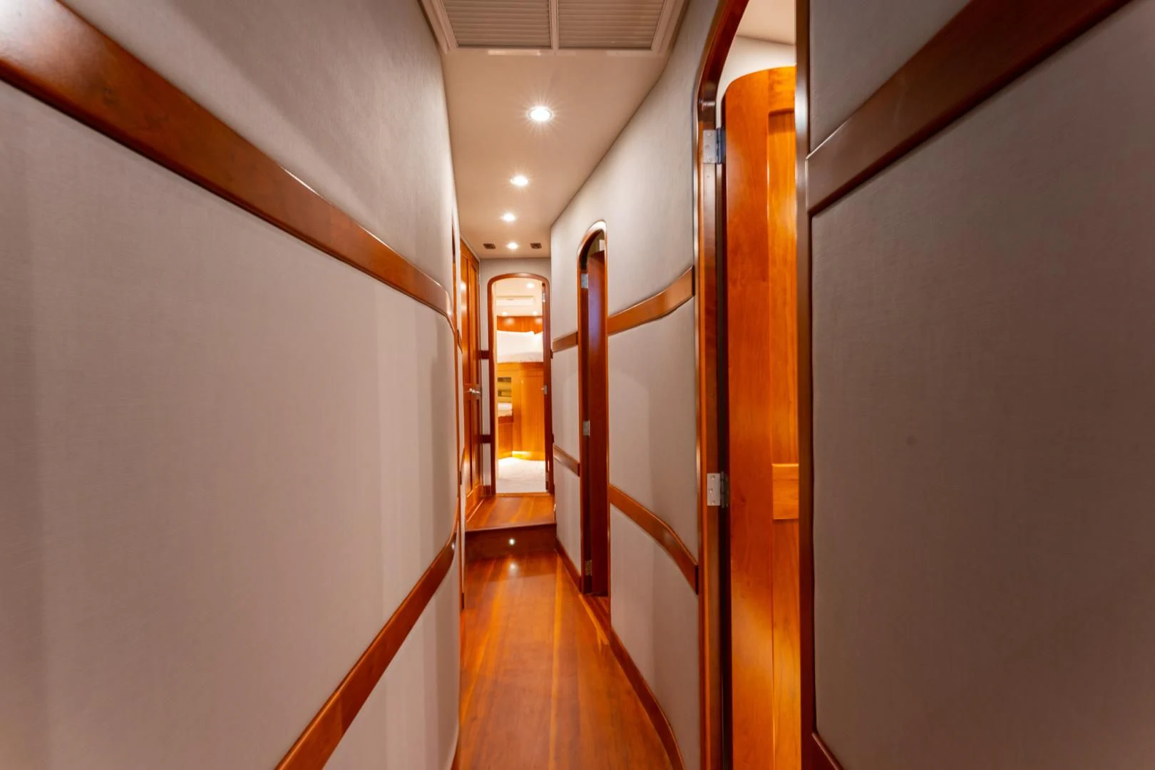 a hallway with doors aboard LET  RIDE Yacht for Sale