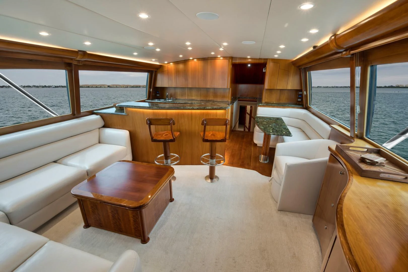 a large living room with a large window aboard LET  RIDE Yacht for Sale