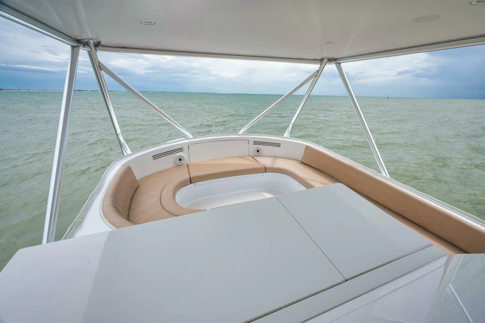 a hand on a steering wheel of a boat aboard LET  RIDE Yacht for Sale