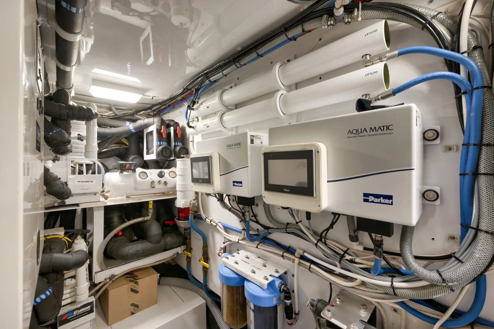 a white machine with blue cables aboard LET  RIDE Yacht for Sale