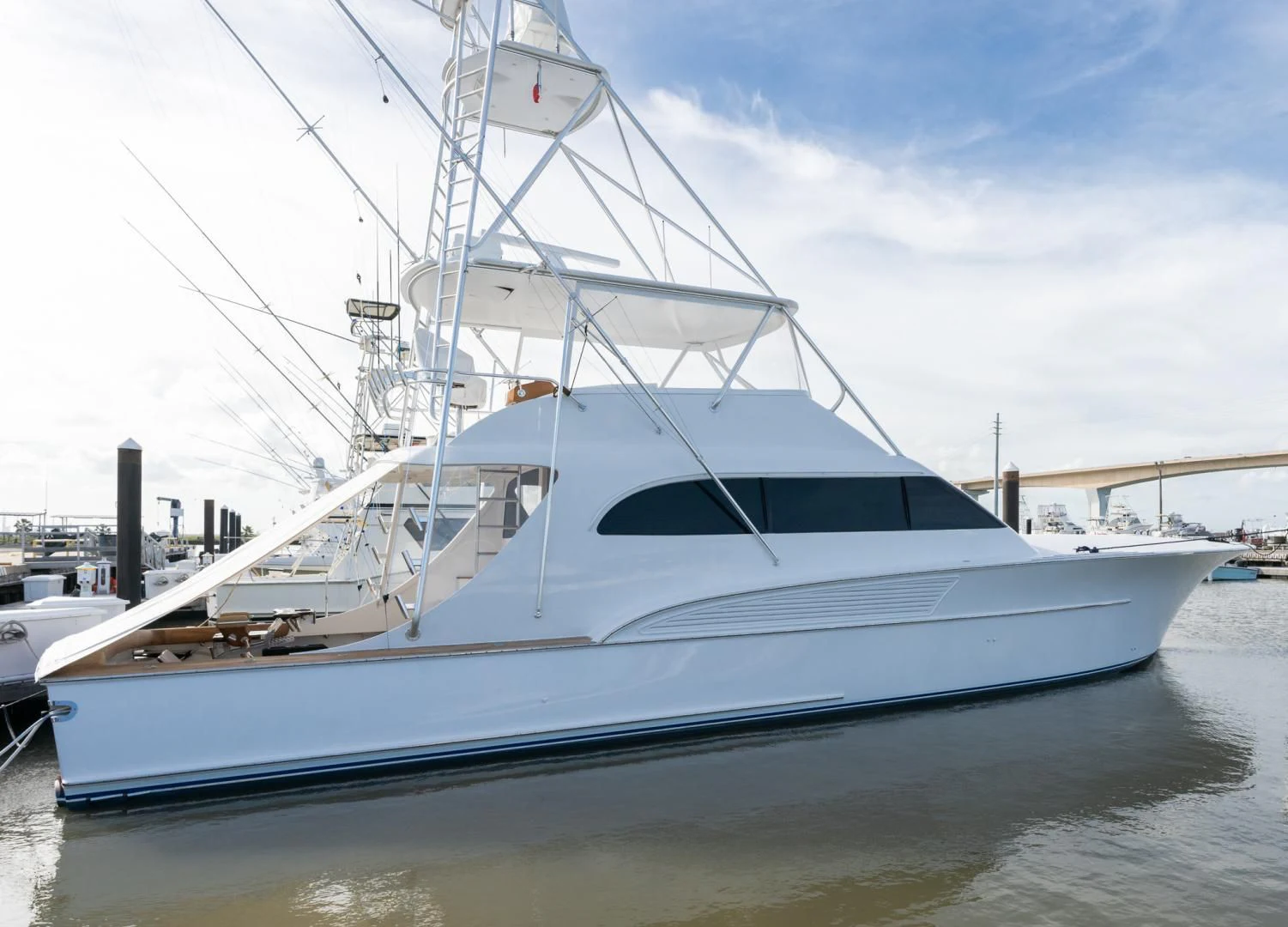 a white yacht docked aboard LET  RIDE Yacht for Sale