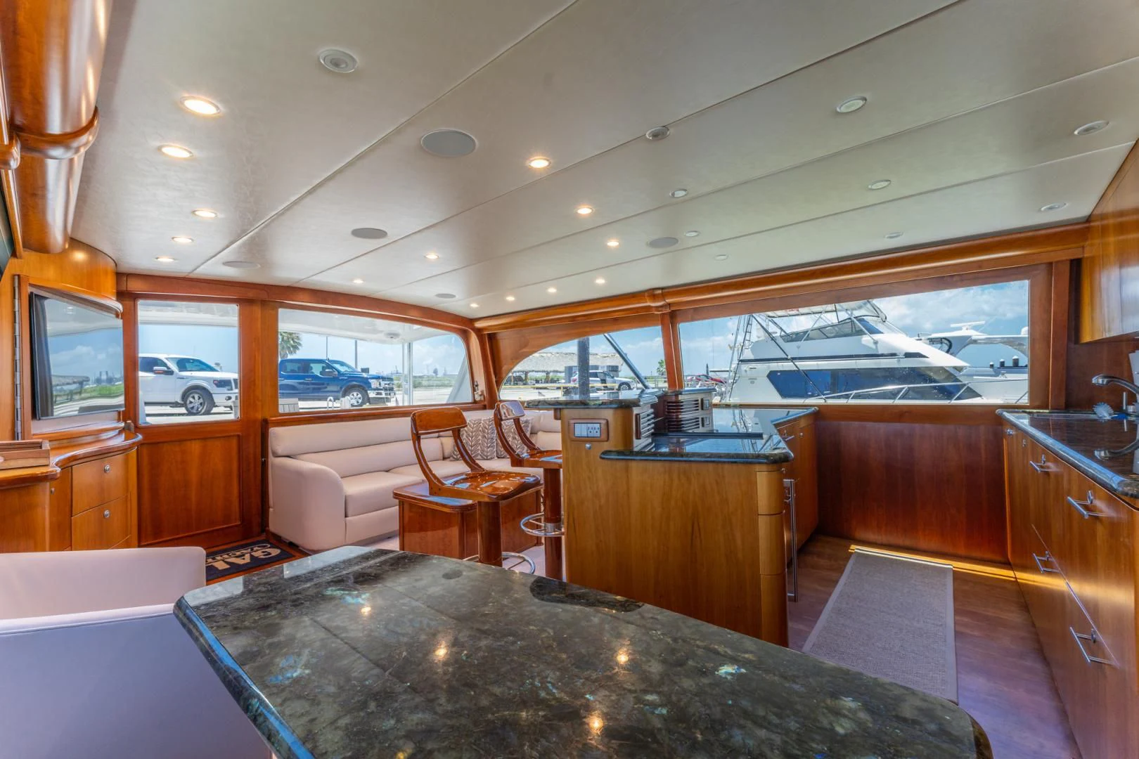 a large kitchen with a large glass window aboard LET  RIDE Yacht for Sale