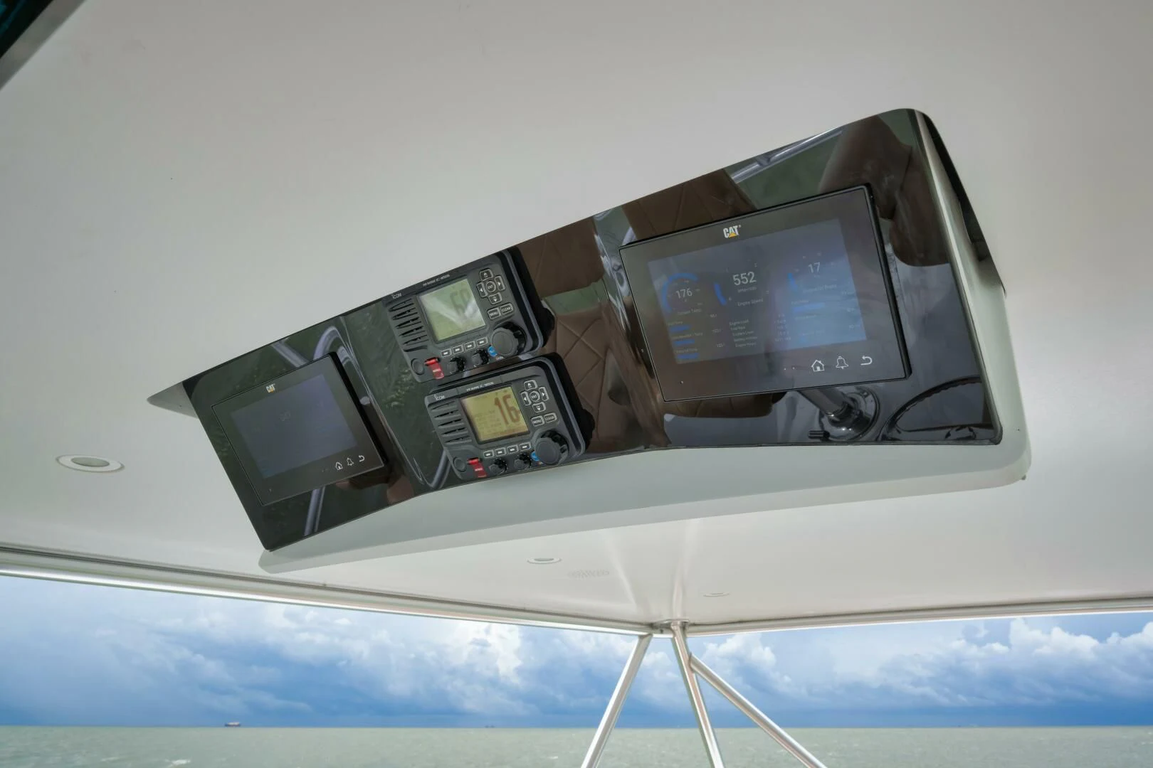 a group of old computer devices on a white table aboard LET  RIDE Yacht for Sale