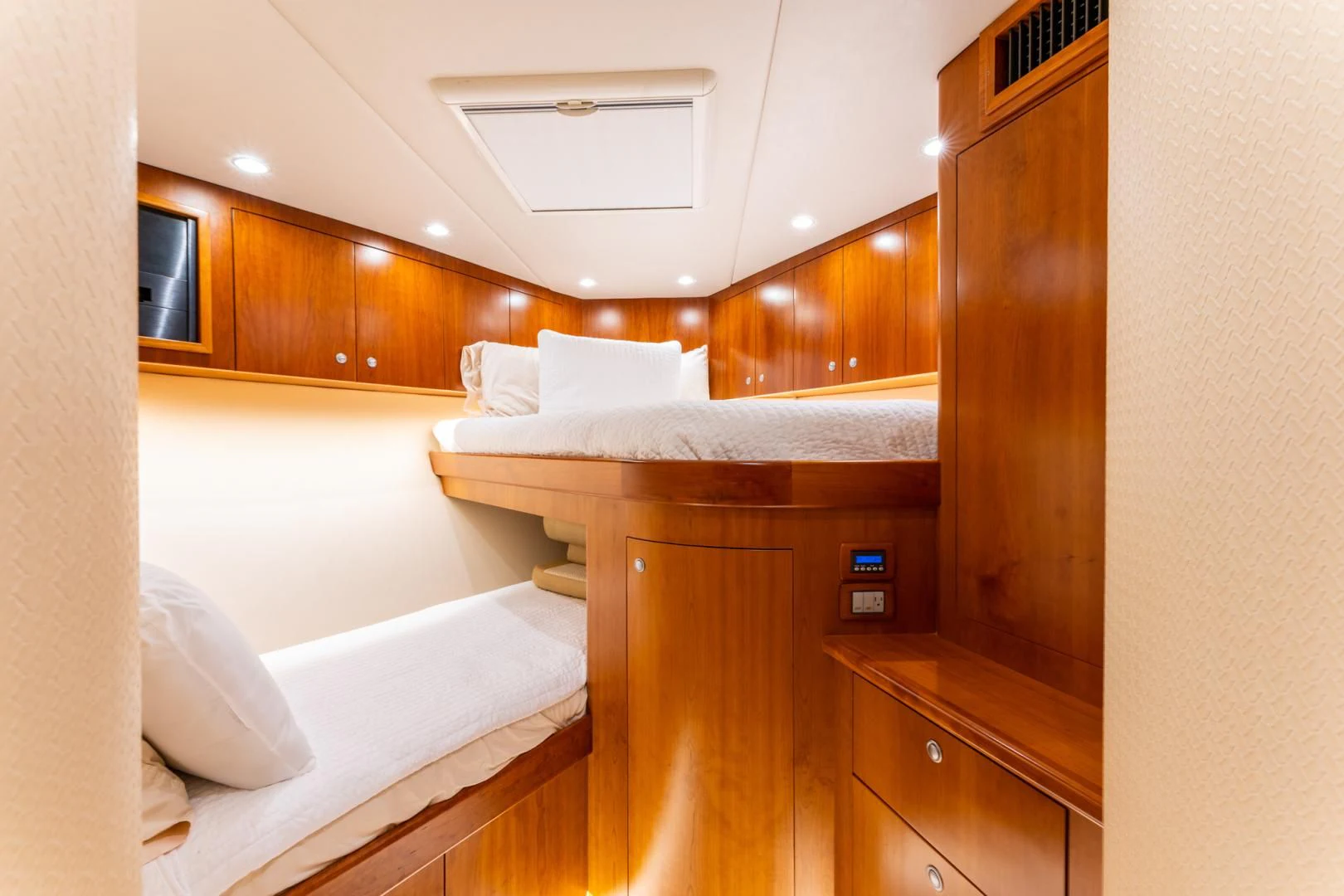 a room with a bed and a desk aboard LET  RIDE Yacht for Sale