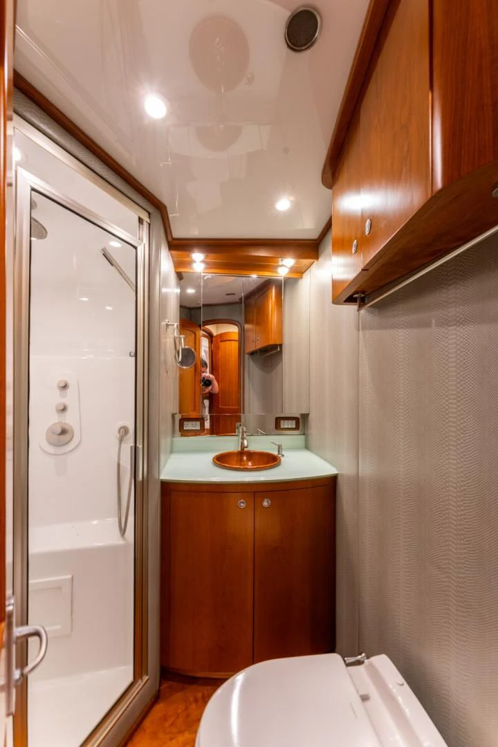 a bathroom with a sink and a toilet aboard LET  RIDE Yacht for Sale