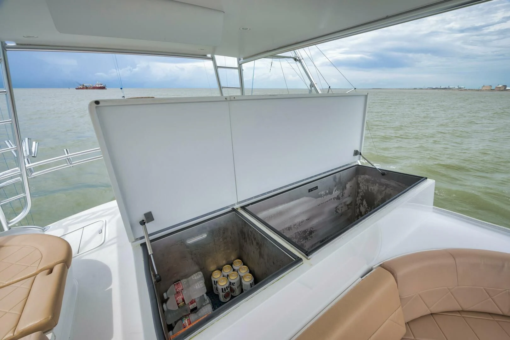 a boat with food on the water aboard LET  RIDE Yacht for Sale
