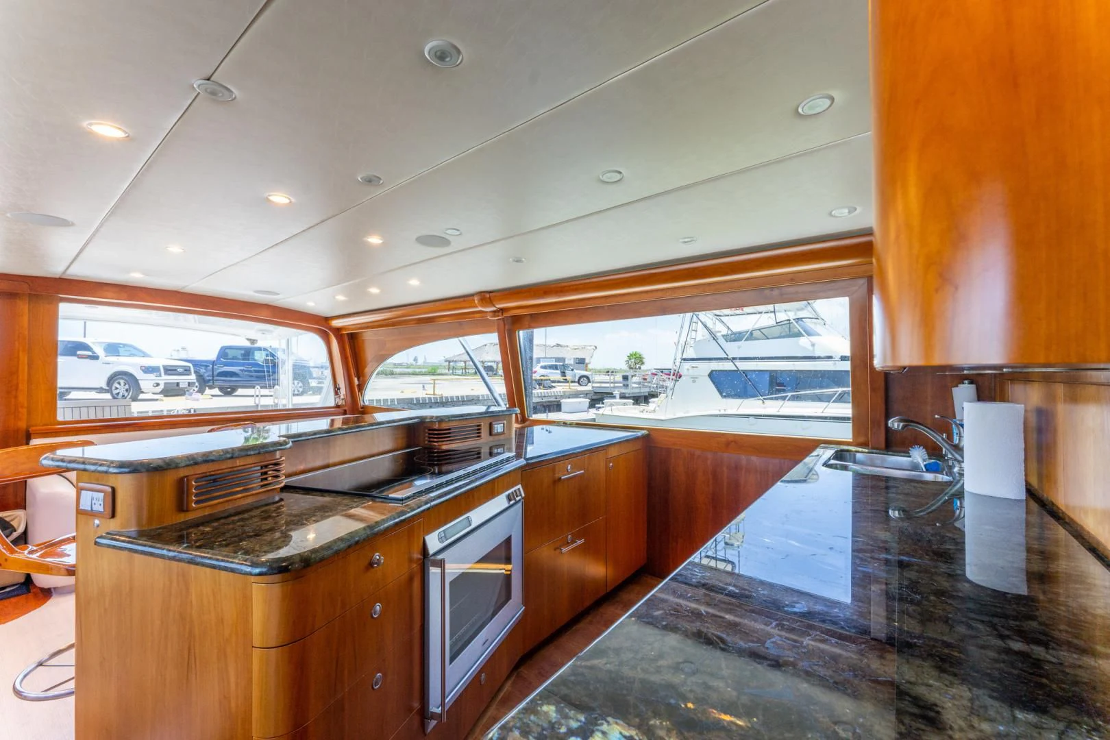 a kitchen with a large island aboard LET  RIDE Yacht for Sale