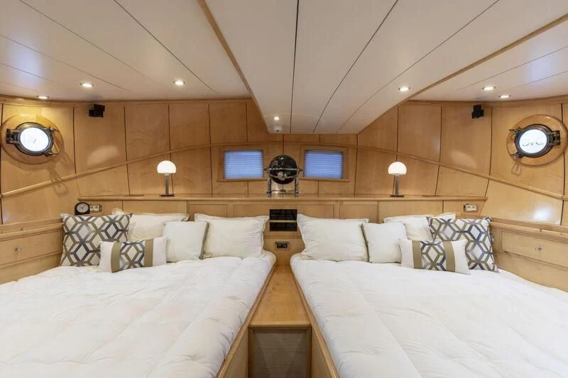 a room with two beds aboard DE VROUWE CHRISTINA Yacht for Sale