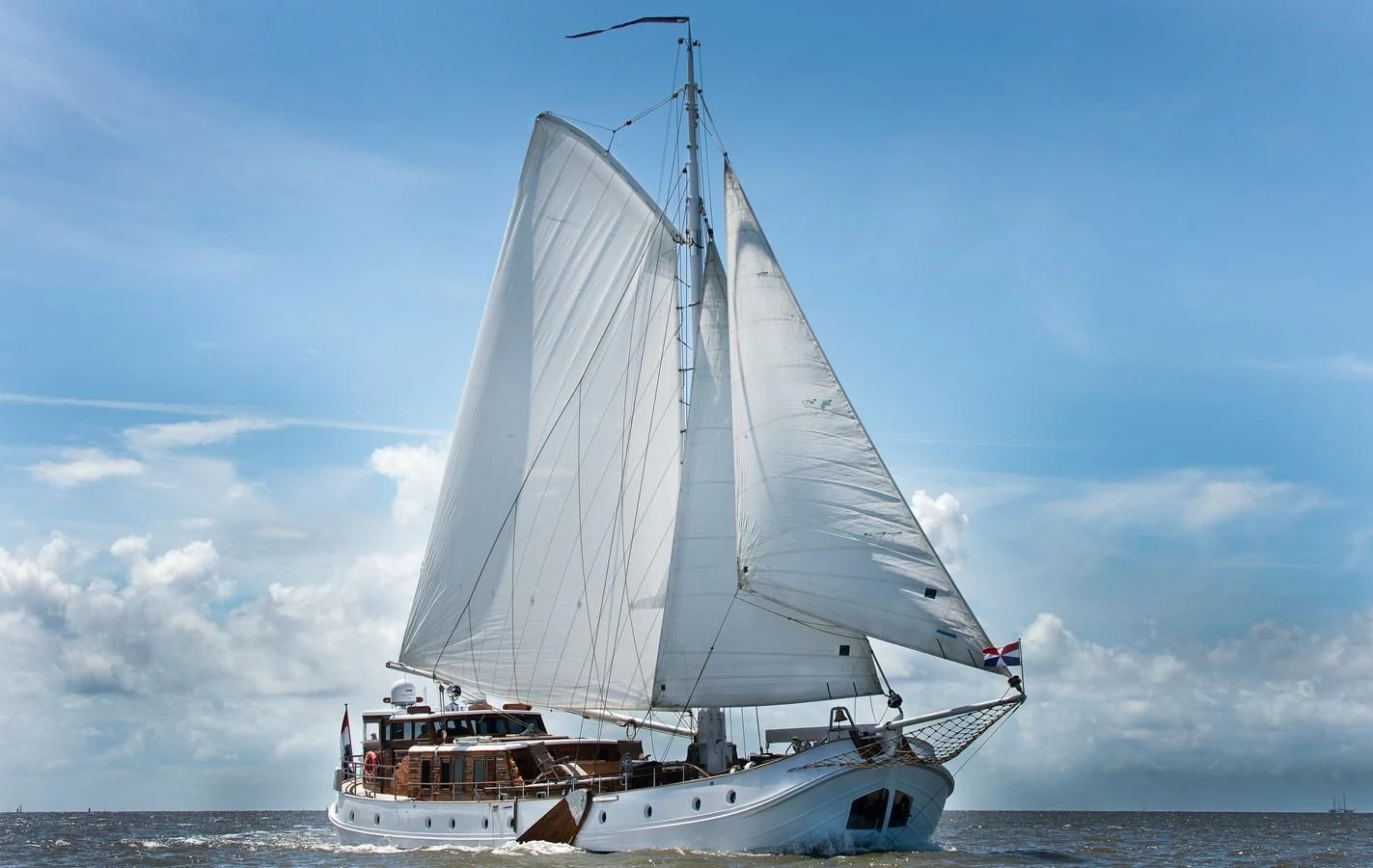 a boat on the water aboard DE VROUWE CHRISTINA Yacht for Sale