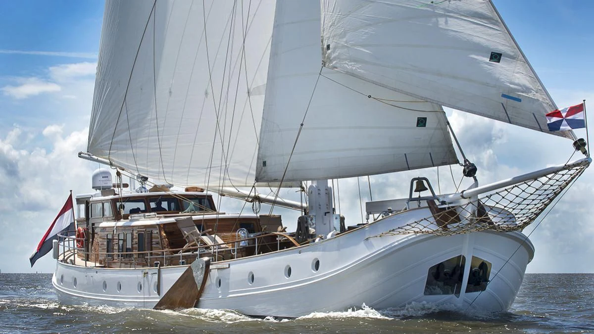 a boat on the water aboard DE VROUWE CHRISTINA Yacht for Sale