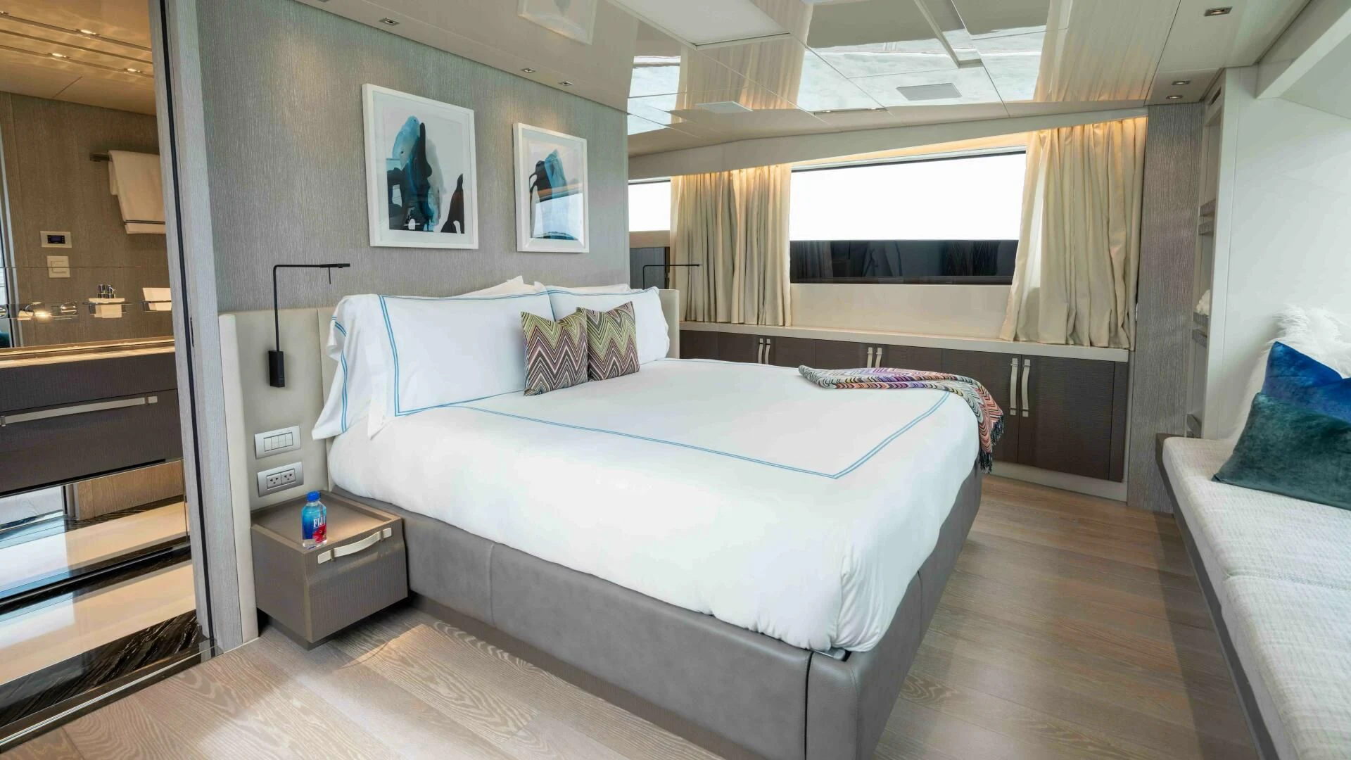 a room with a bed and a window aboard TIME OUT I Yacht for Sale