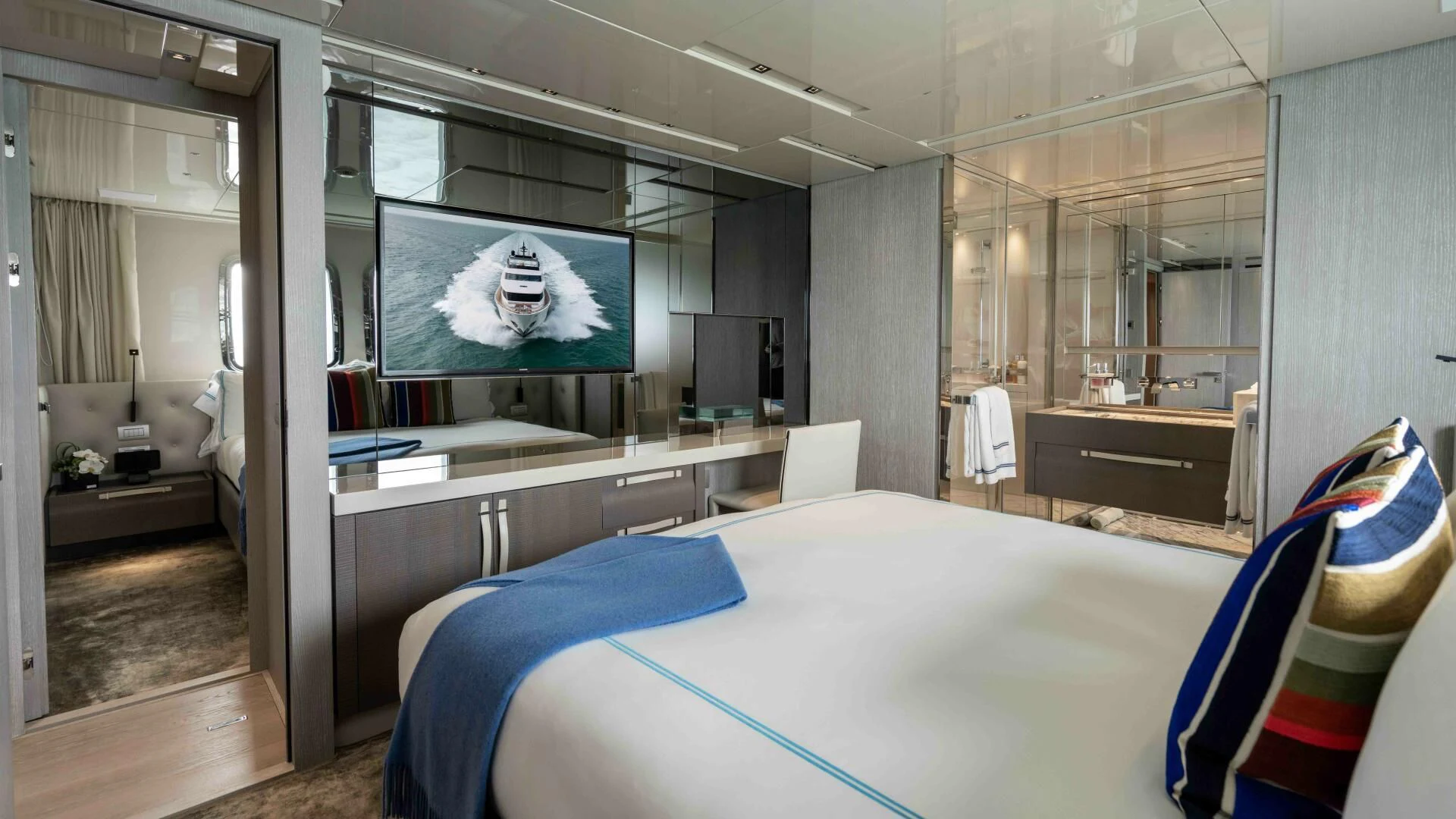 a bedroom with a large mirror aboard TIME OUT I Yacht for Sale