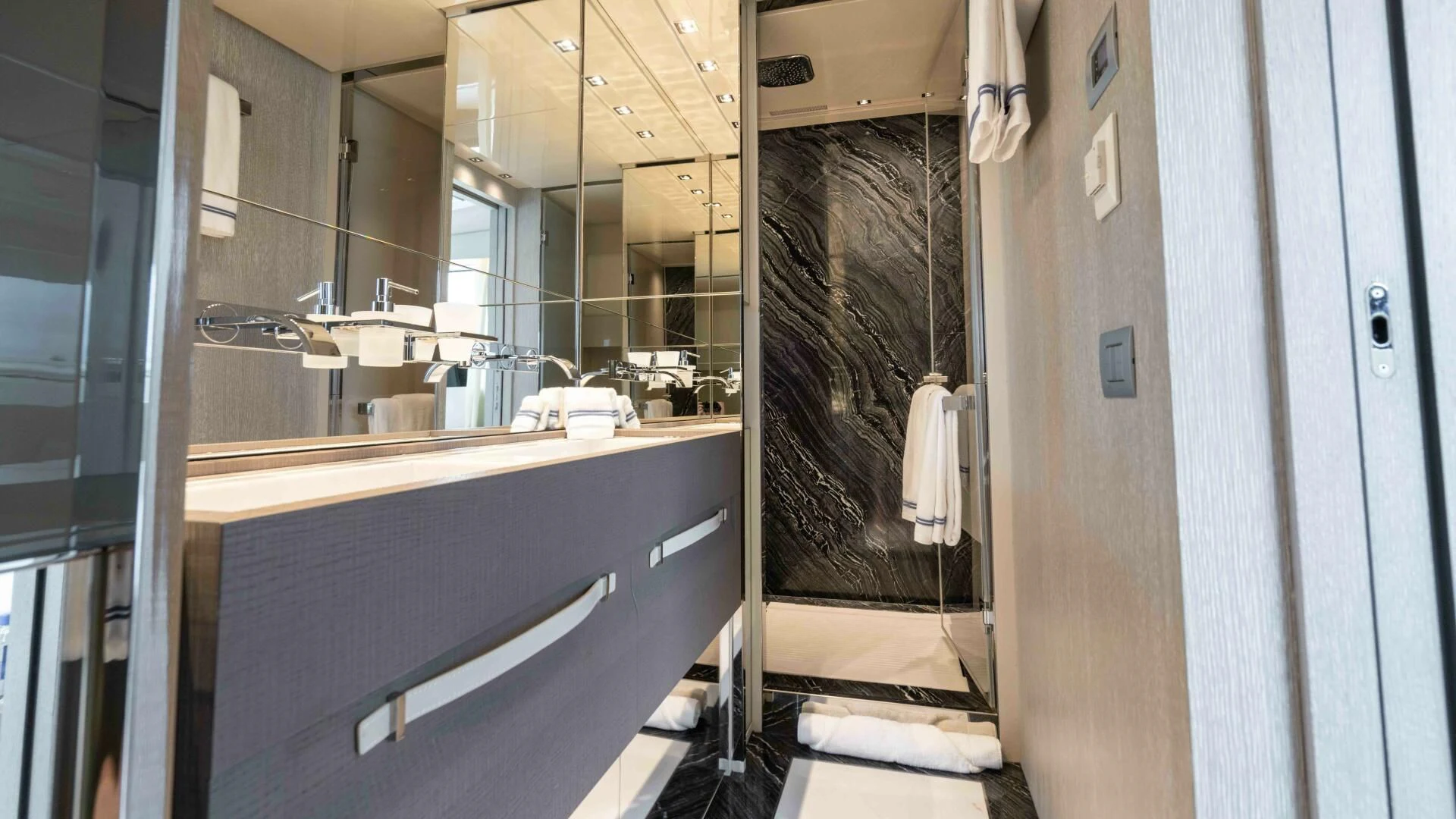 a bathroom with a sink and a mirror aboard TIME OUT I Yacht for Sale