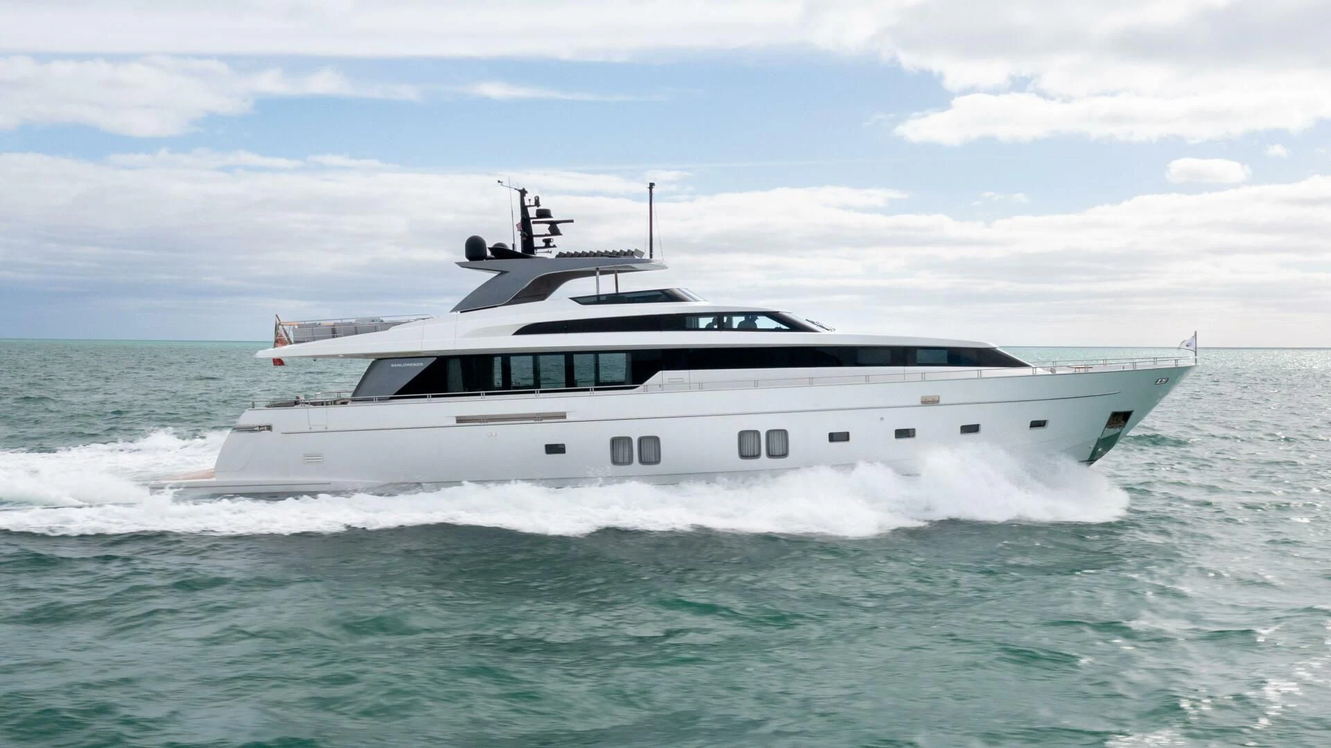 a white boat in the water aboard TIME OUT I Yacht for Sale