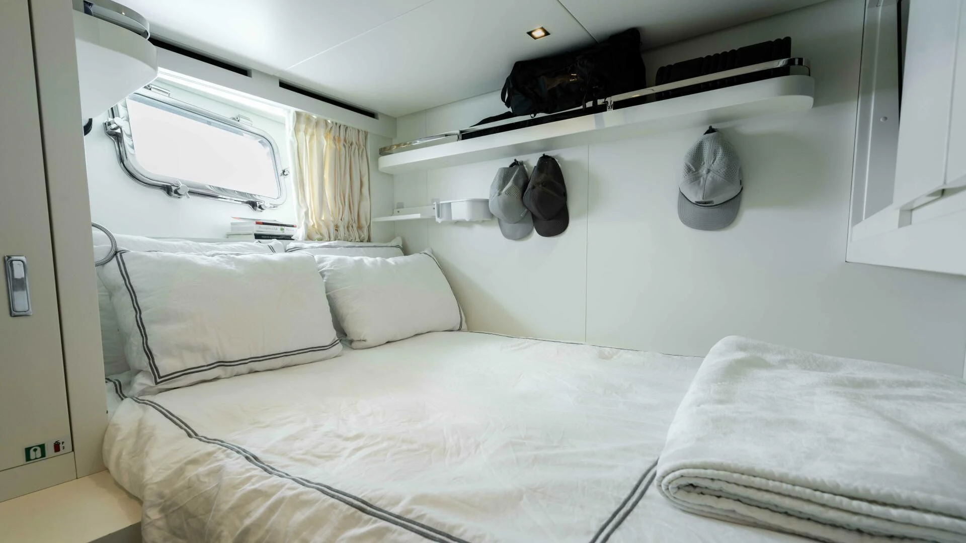 a bed with white sheets aboard TIME OUT I Yacht for Sale