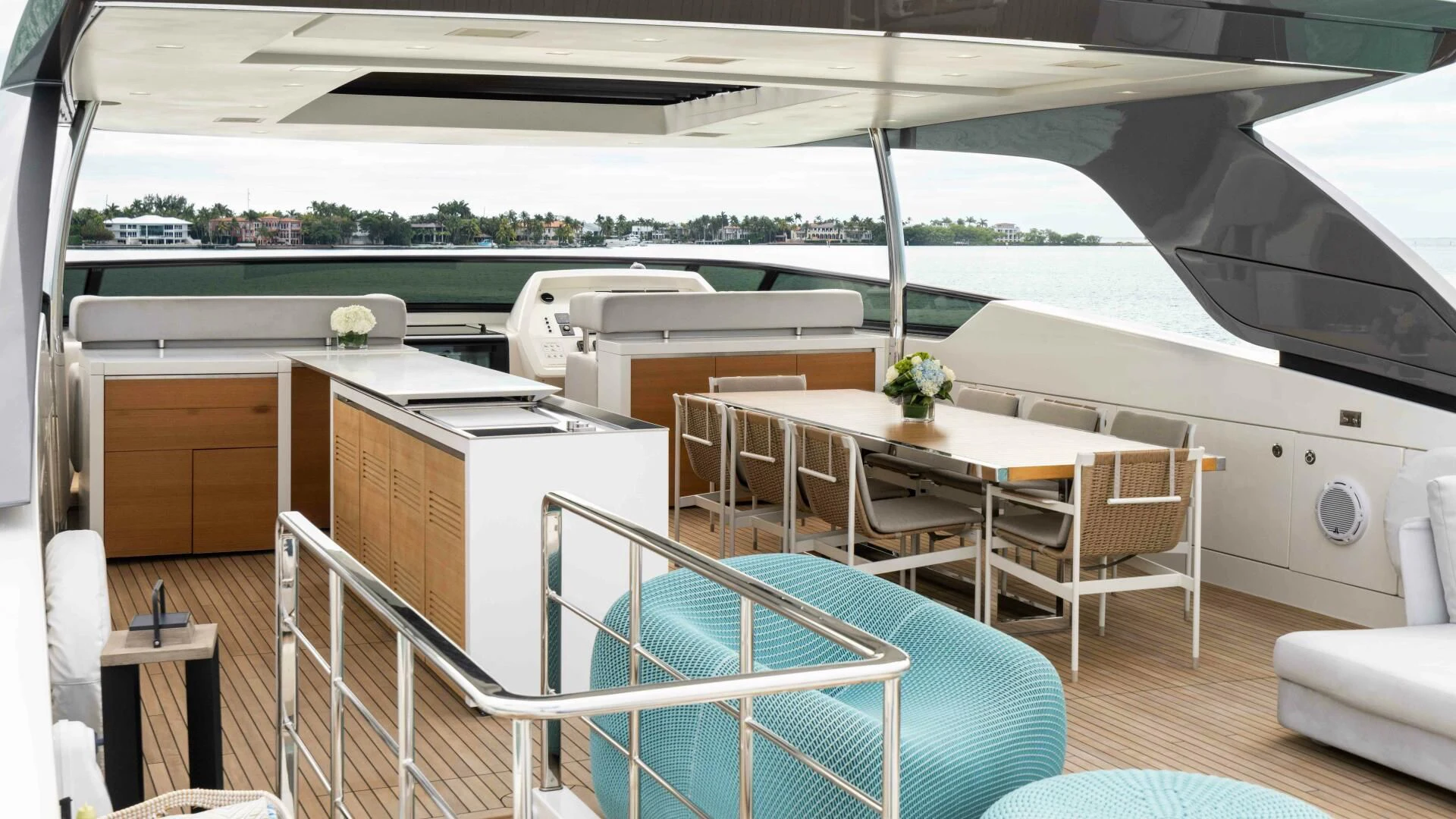 a large white and blue house with a pool table and chairs aboard TIME OUT I Yacht for Sale
