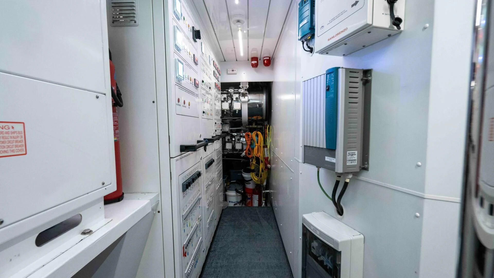a room with white cabinets and a blue floor aboard TIME OUT I Yacht for Sale