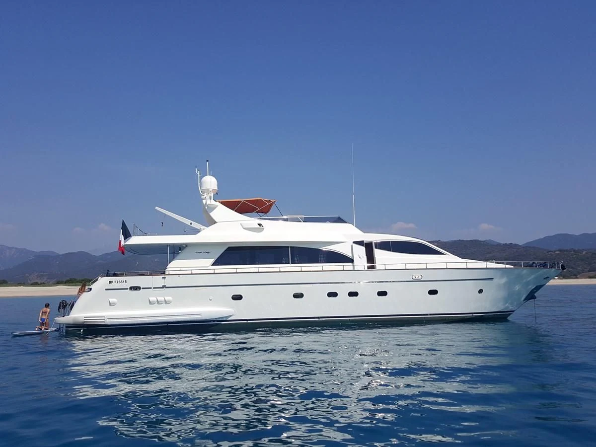 a white yacht on the water aboard BARON B Yacht for Sale