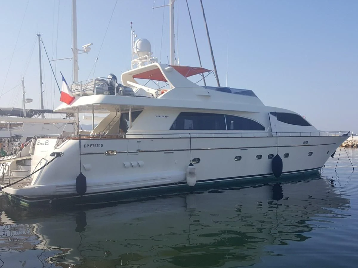 a white yacht on the water aboard BARON B Yacht for Sale