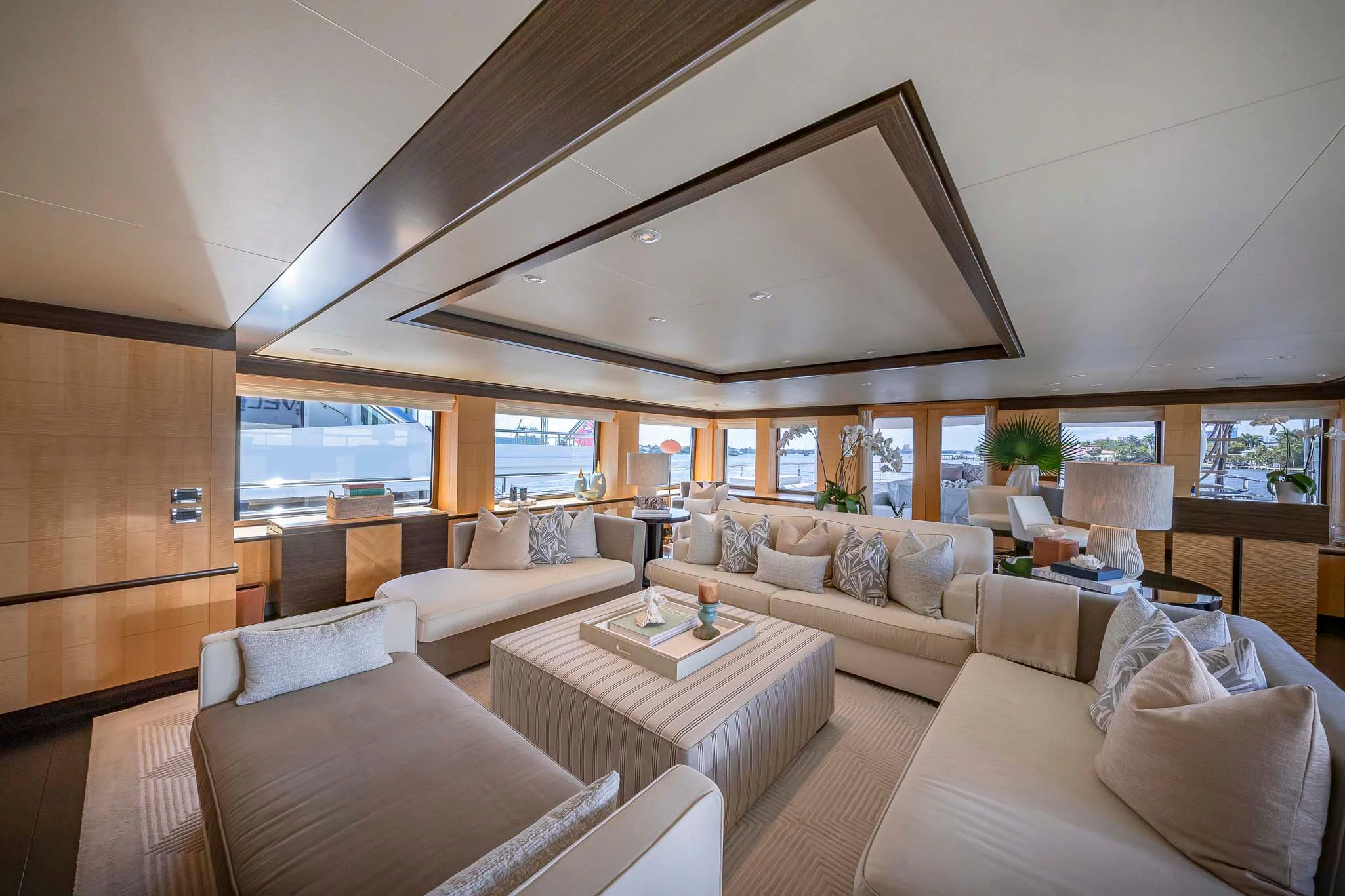 a living room with a large window aboard REVELRY Yacht for Sale