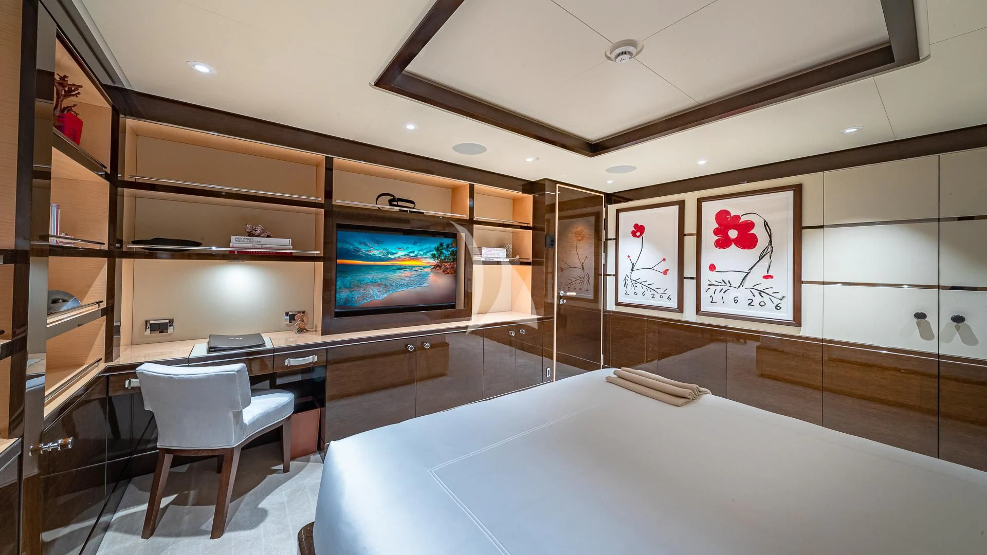 a room with a tv and a table and chairs aboard REVELRY Yacht for Sale
