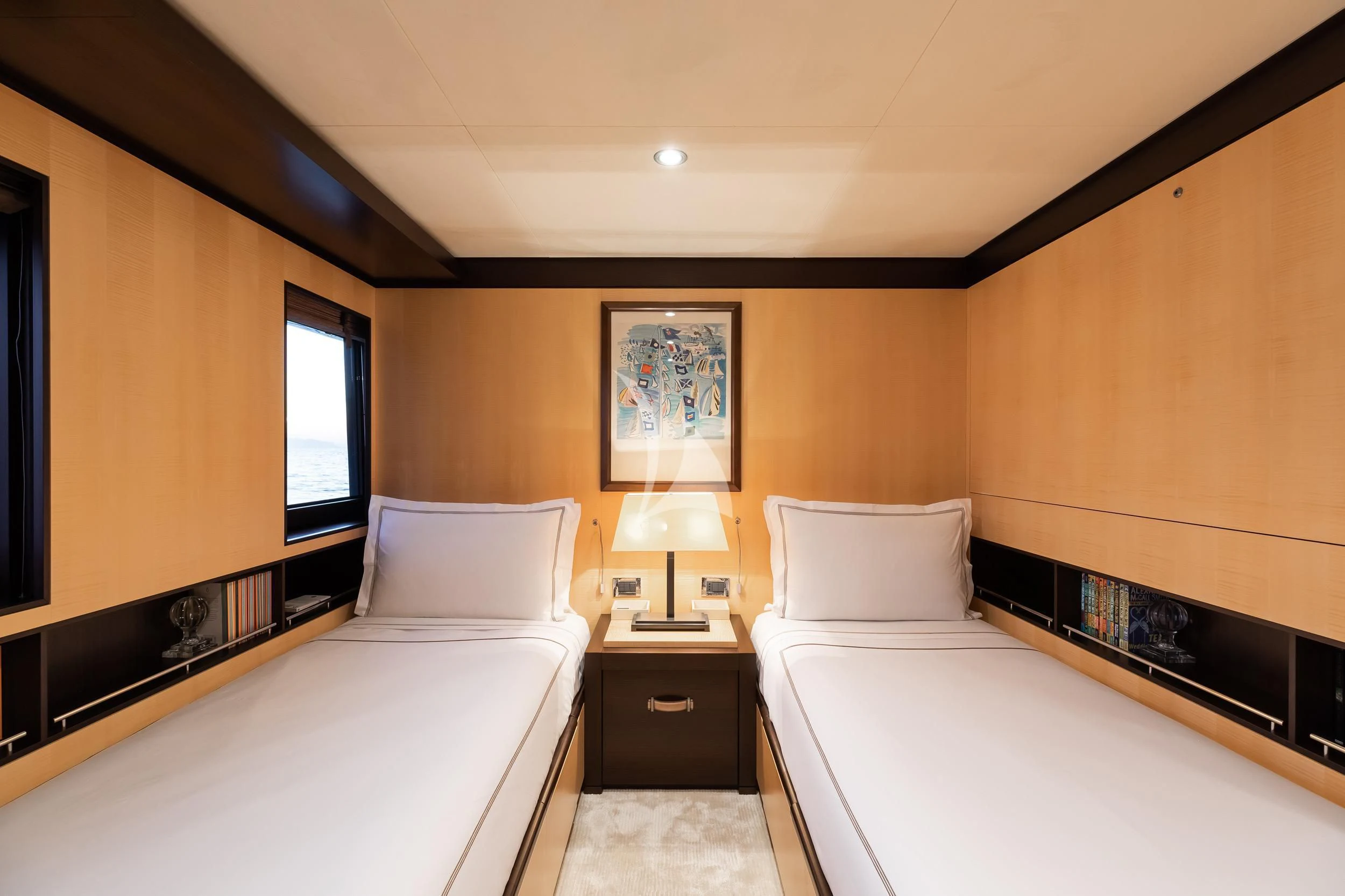 a hotel room with two beds aboard REVELRY Yacht for Sale