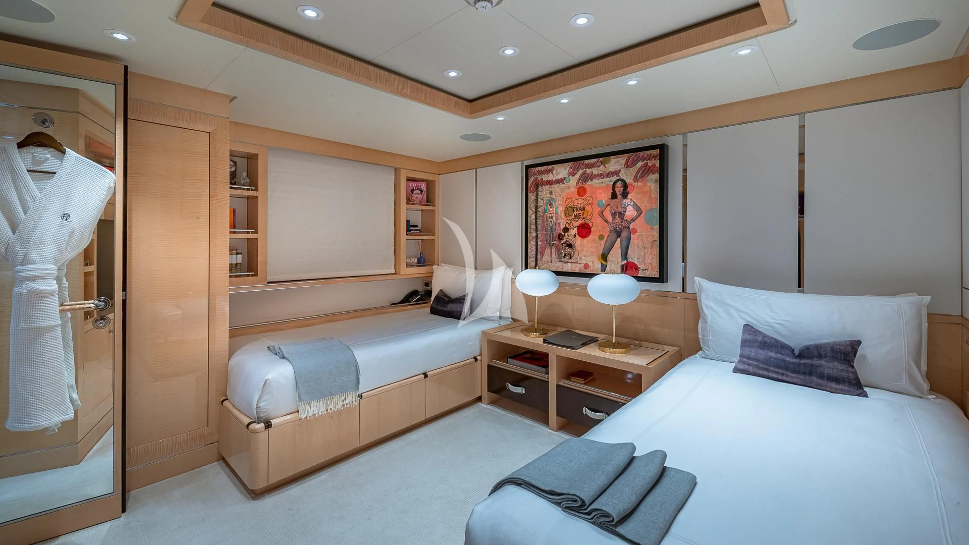 a room with a bed and a desk aboard REVELRY Yacht for Sale