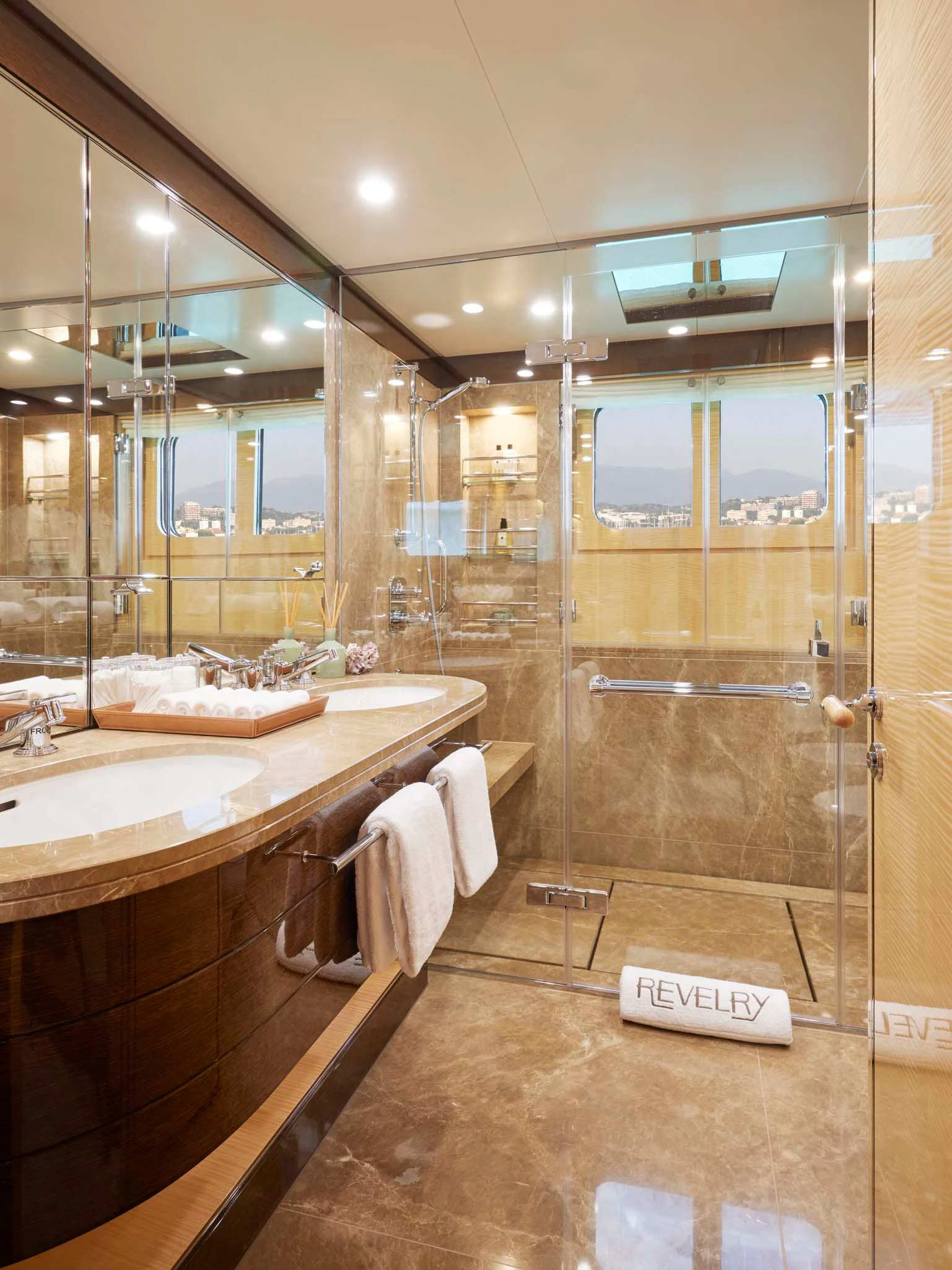 a bathroom with a glass shower aboard REVELRY Yacht for Sale