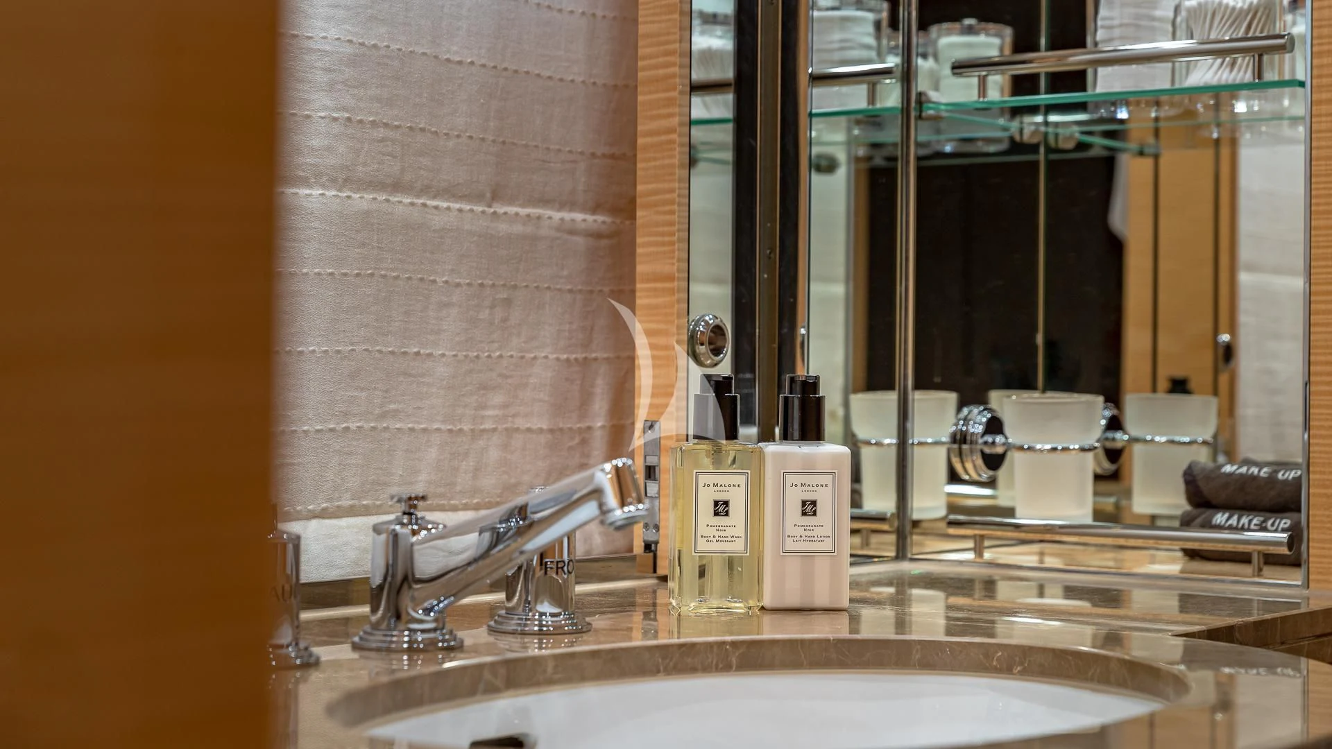 a bathroom with a large mirror aboard REVELRY Yacht for Sale