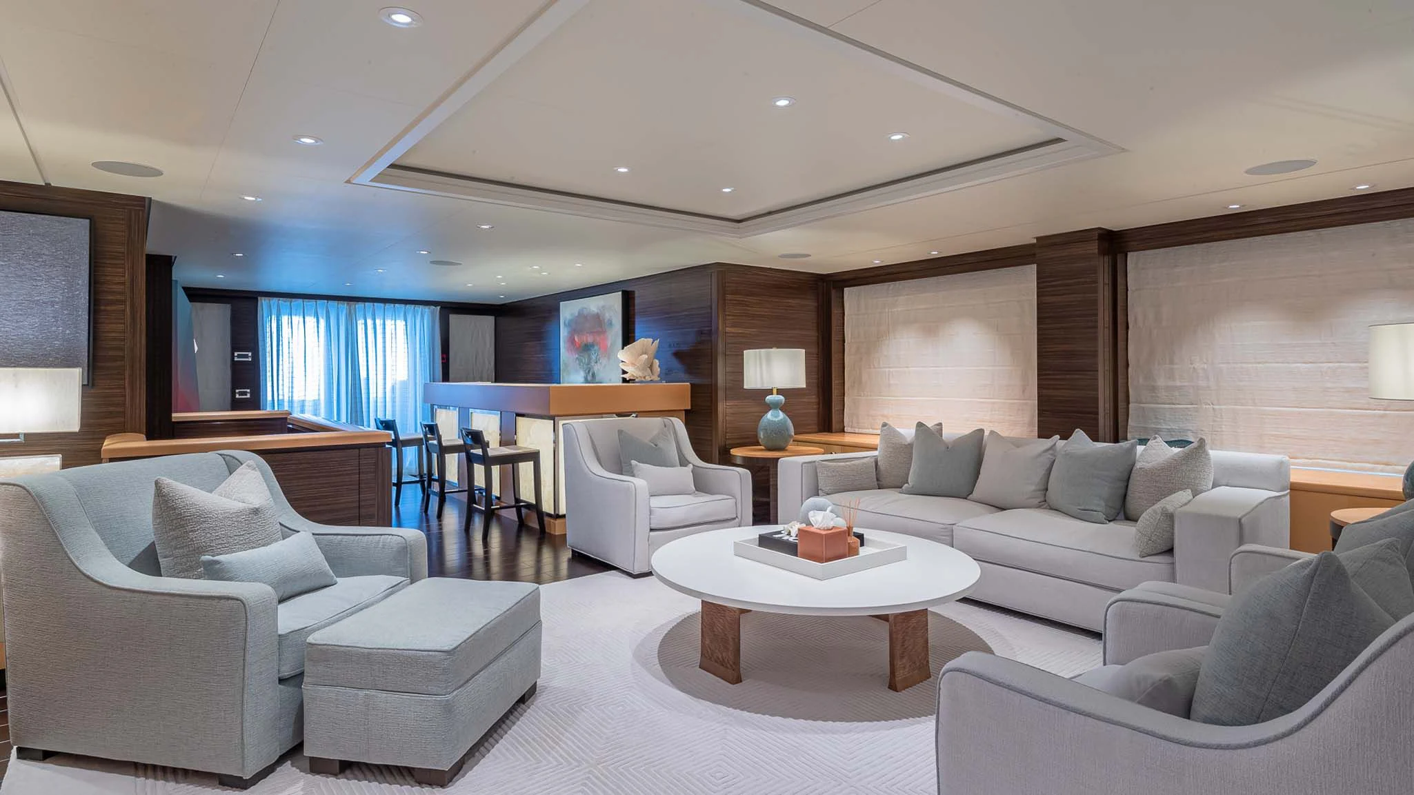 a living room with a couch and a table aboard REVELRY Yacht for Sale