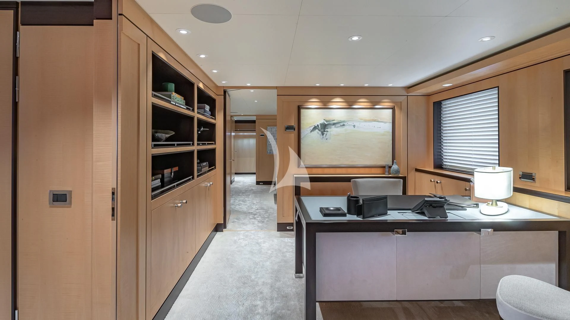 a room with a desk and a window aboard REVELRY Yacht for Sale
