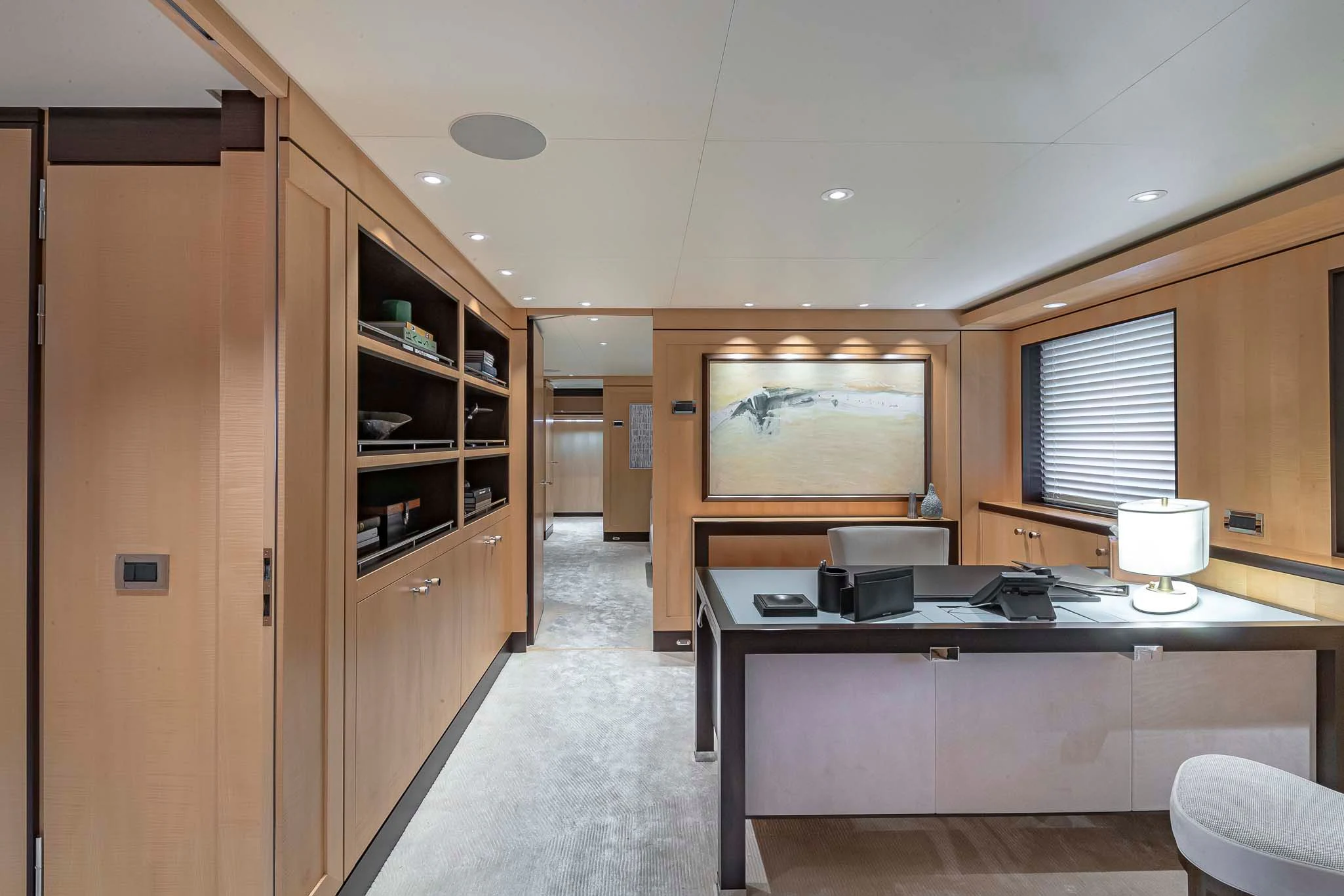 a room with a desk and a chair aboard REVELRY Yacht for Sale