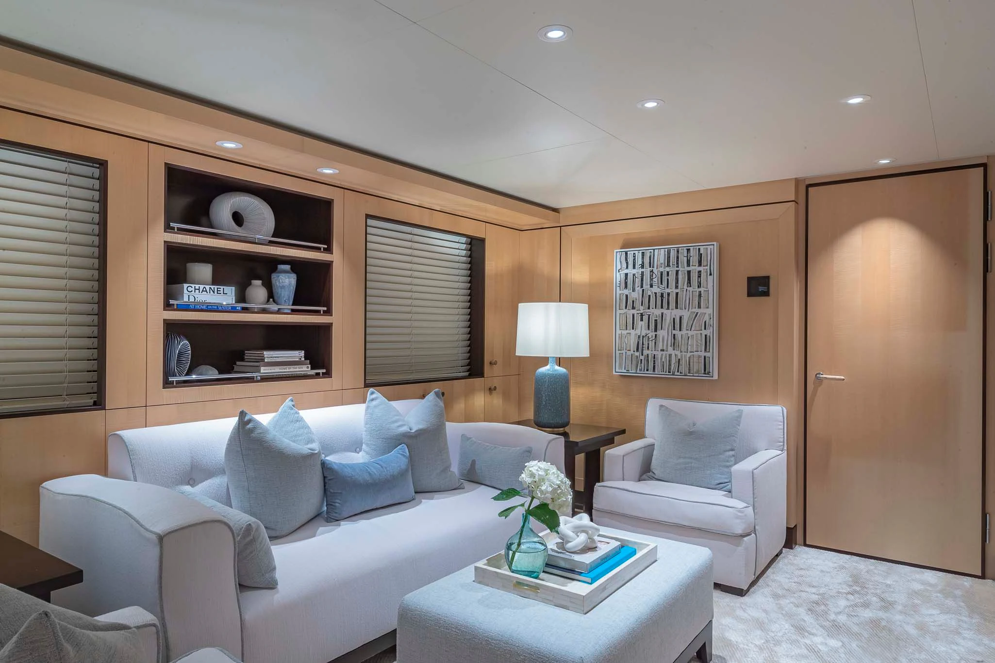 a living room with a white couch aboard REVELRY Yacht for Sale