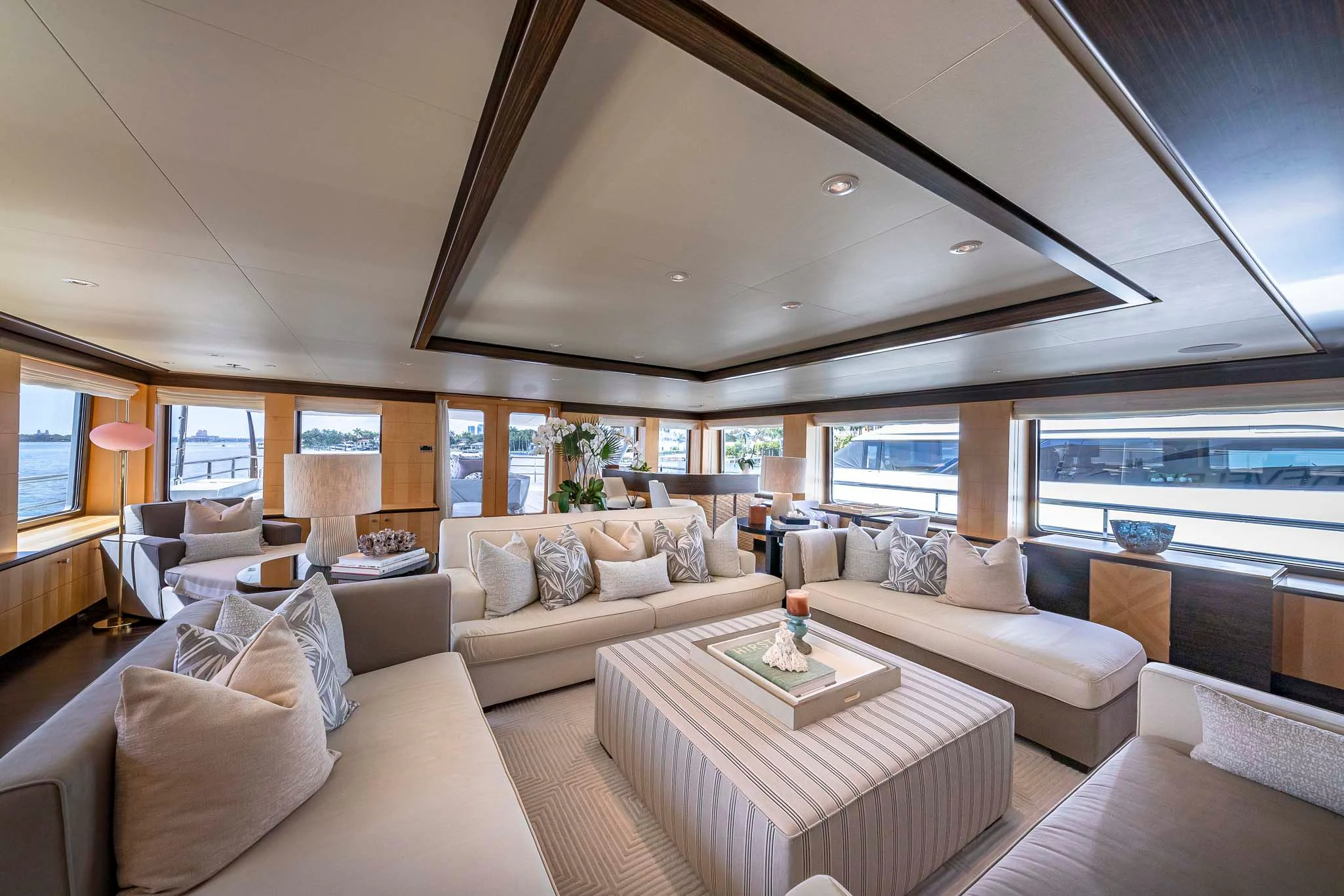 a living room with a large window aboard REVELRY Yacht for Sale