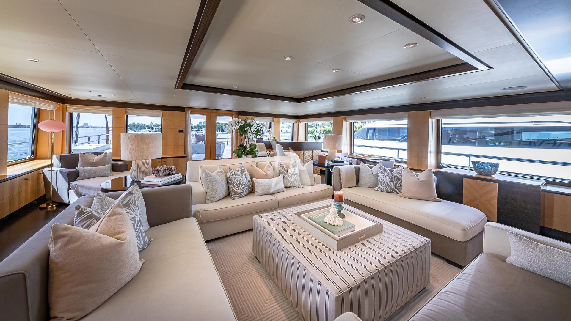 a living room with a large window aboard REVELRY Yacht for Sale