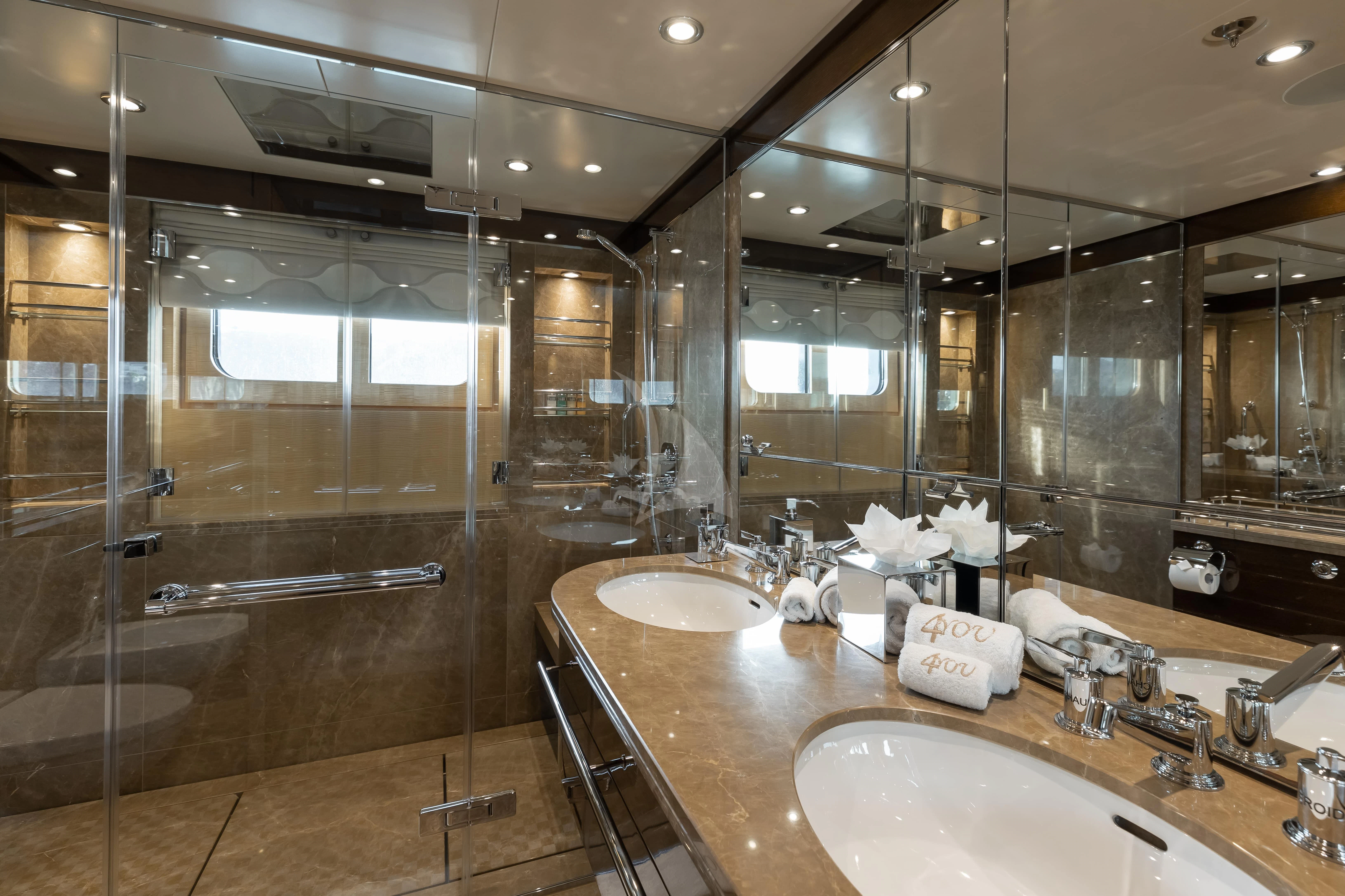 a bathroom with two sinks aboard REVELRY Yacht for Sale