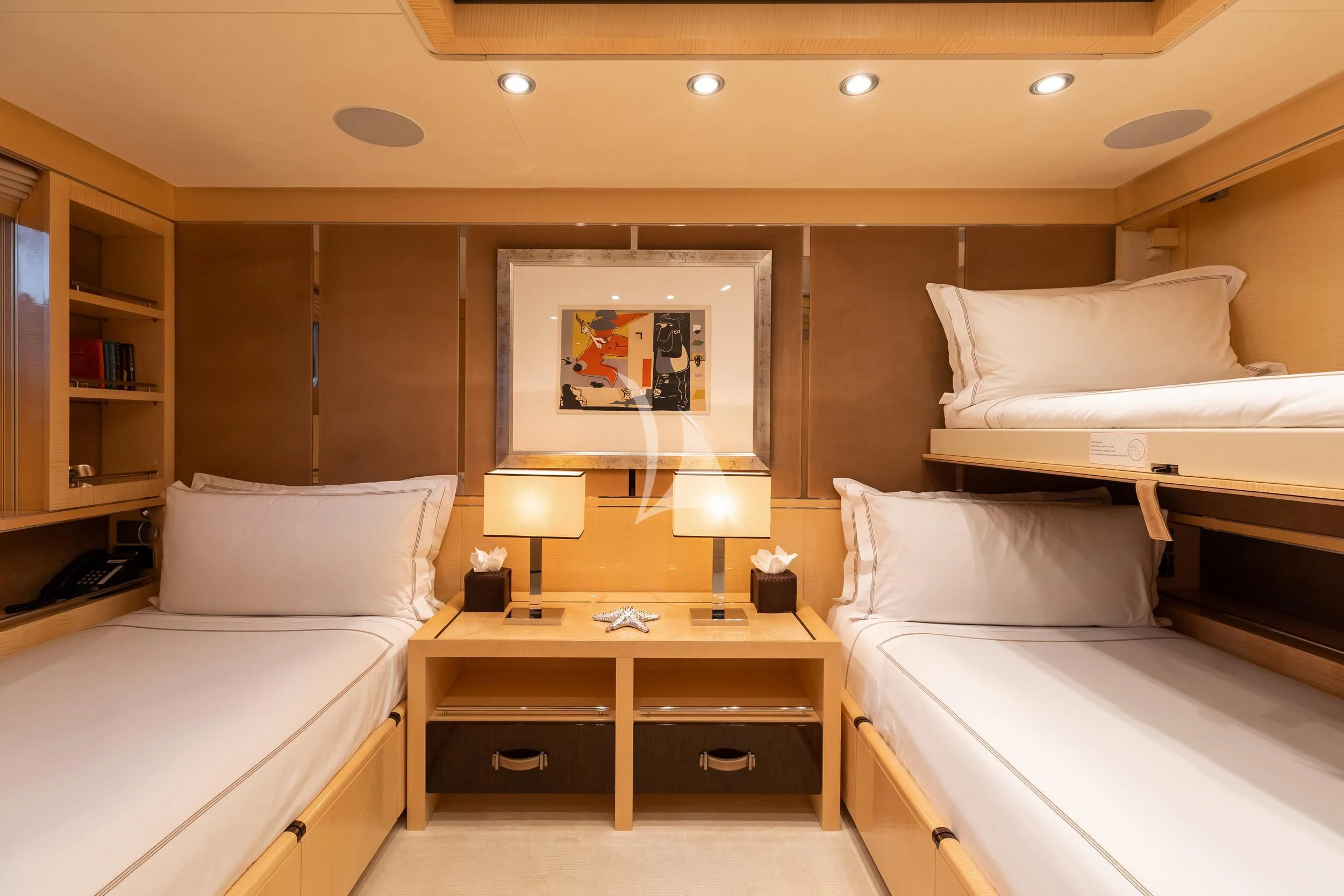 a room with two beds and a mirror aboard REVELRY Yacht for Sale