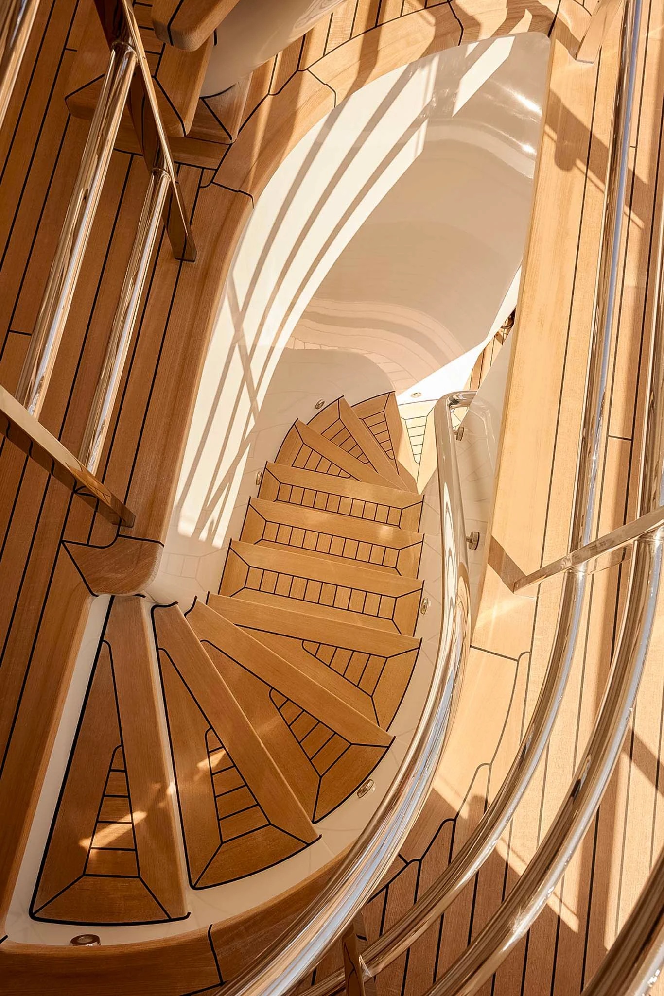 a staircase with wooden stairs aboard REVELRY Yacht for Sale