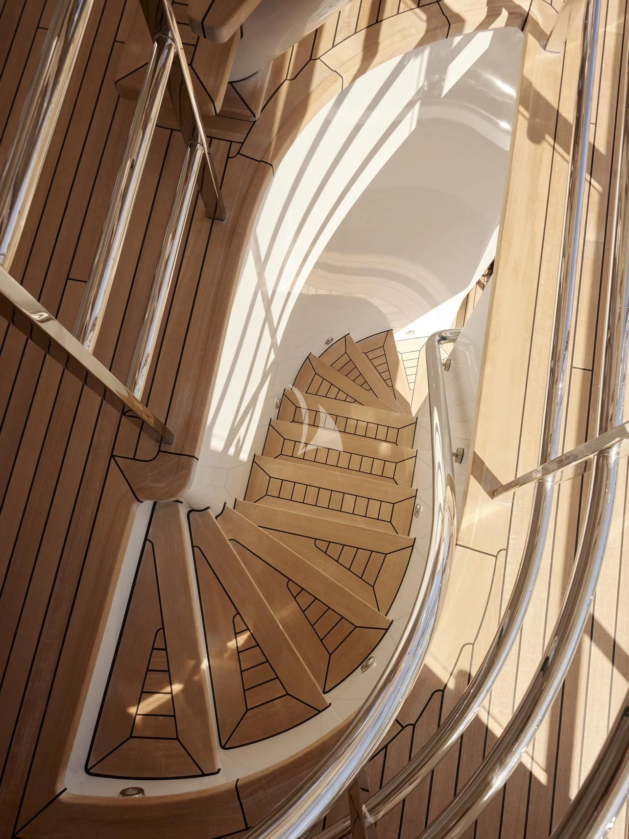 a wooden staircase with wood railings aboard REVELRY Yacht for Sale