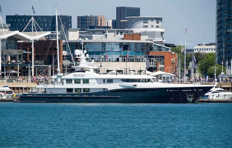 a large white boat in the water aboard REVELRY Yacht for Sale