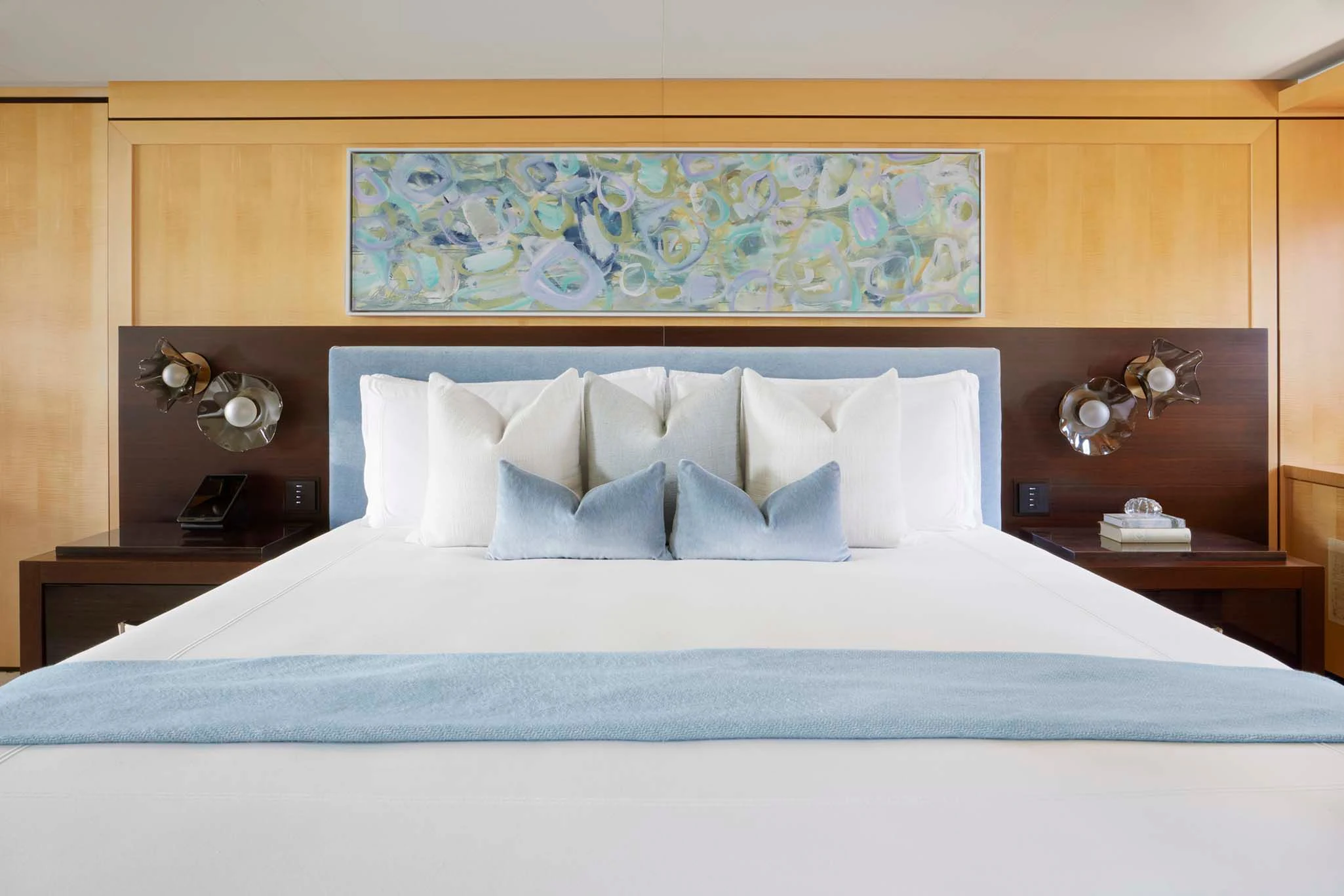 a bed with white sheets aboard REVELRY Yacht for Sale