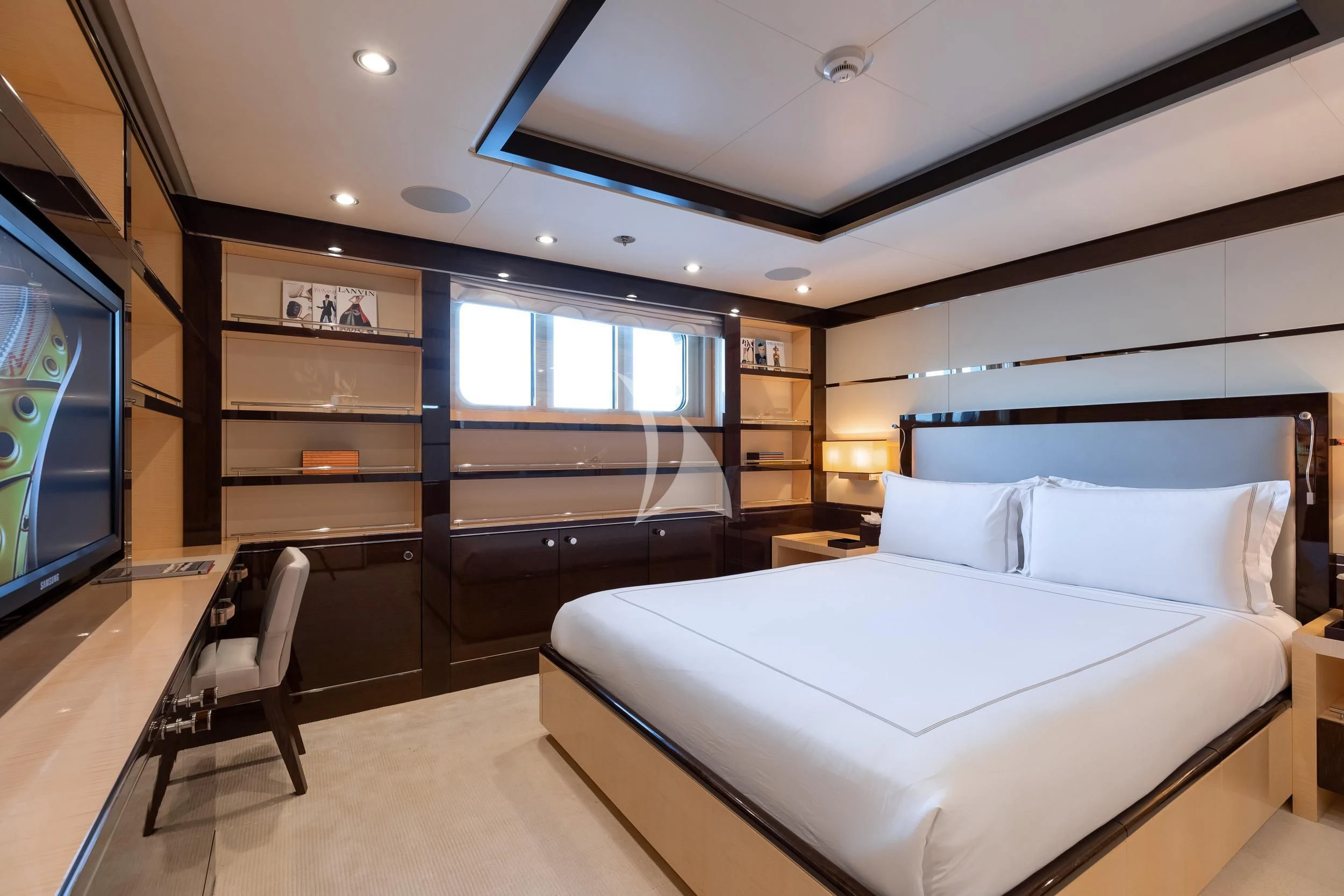 a bedroom with a large bed aboard REVELRY Yacht for Sale