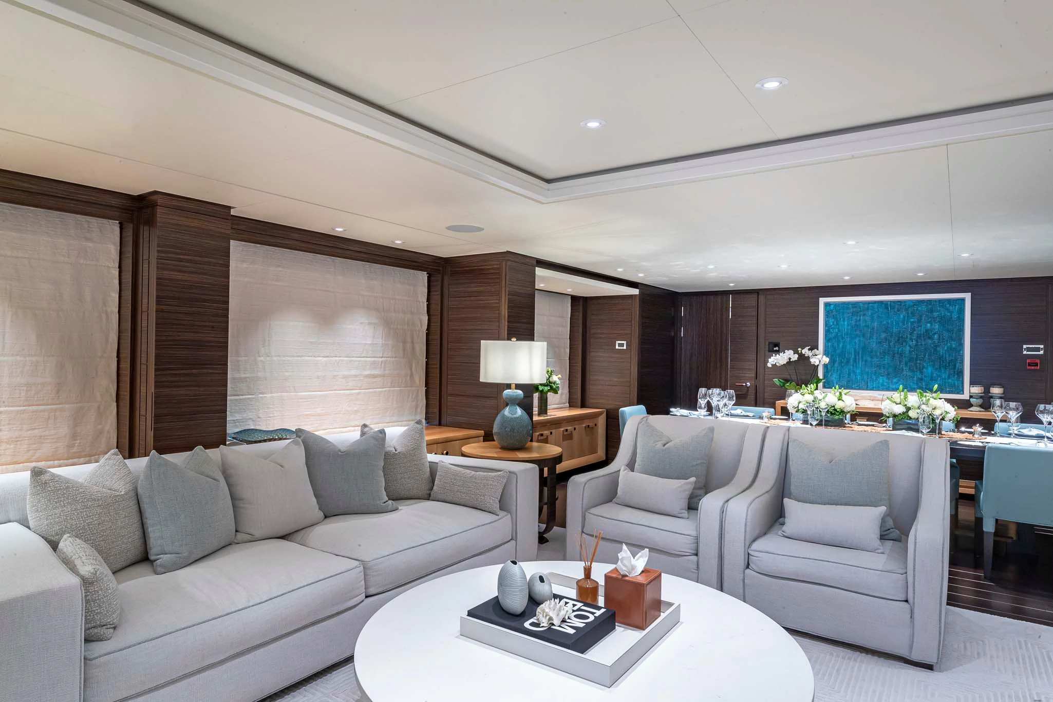 a living room with a couch and a table aboard REVELRY Yacht for Sale